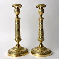 Pair of elegant Empire Candlesticks in gilt bronze from the 1820s