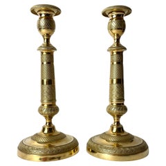 Pair of elegant Empire Candlesticks in gilt bronze from the 1820s