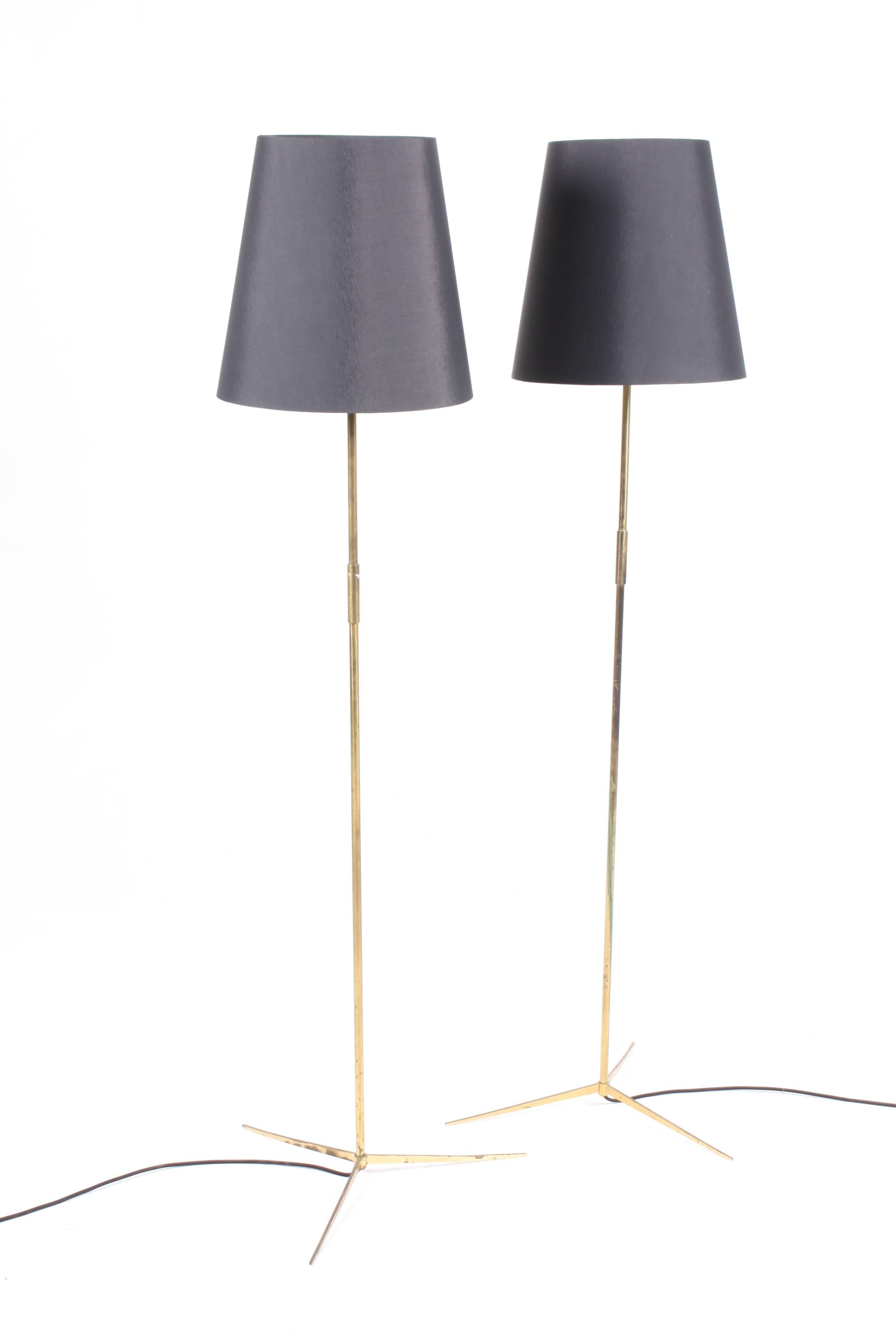 Pair of elegant floor lamps in patinated brass. This lamp is a Fine example of minimalistic Scandinavian design and quality. Designed and made by Holm Sørensen, circa 1960.