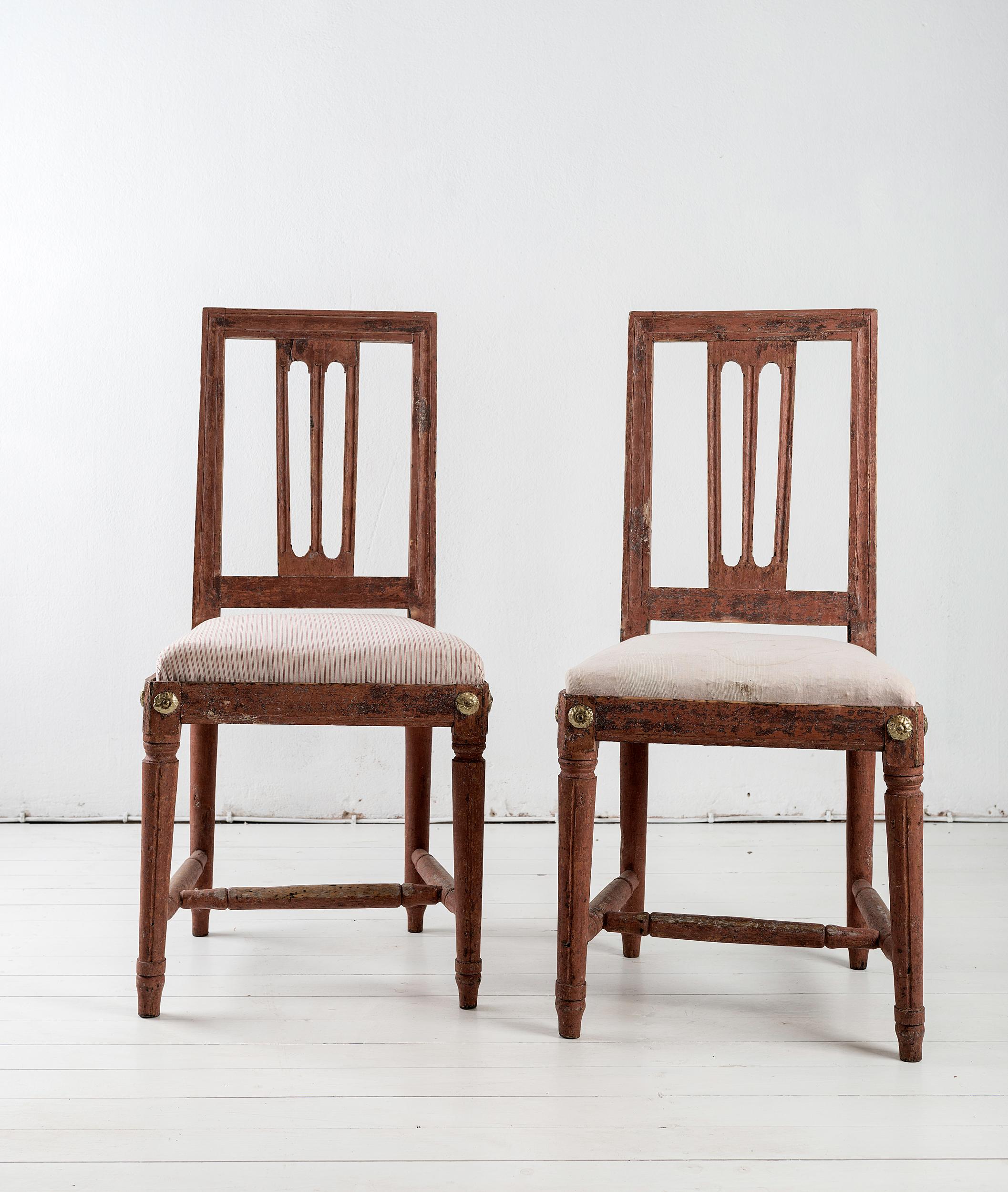 Fine pair of Gustavian dining chairs, retaining their original paint.

 