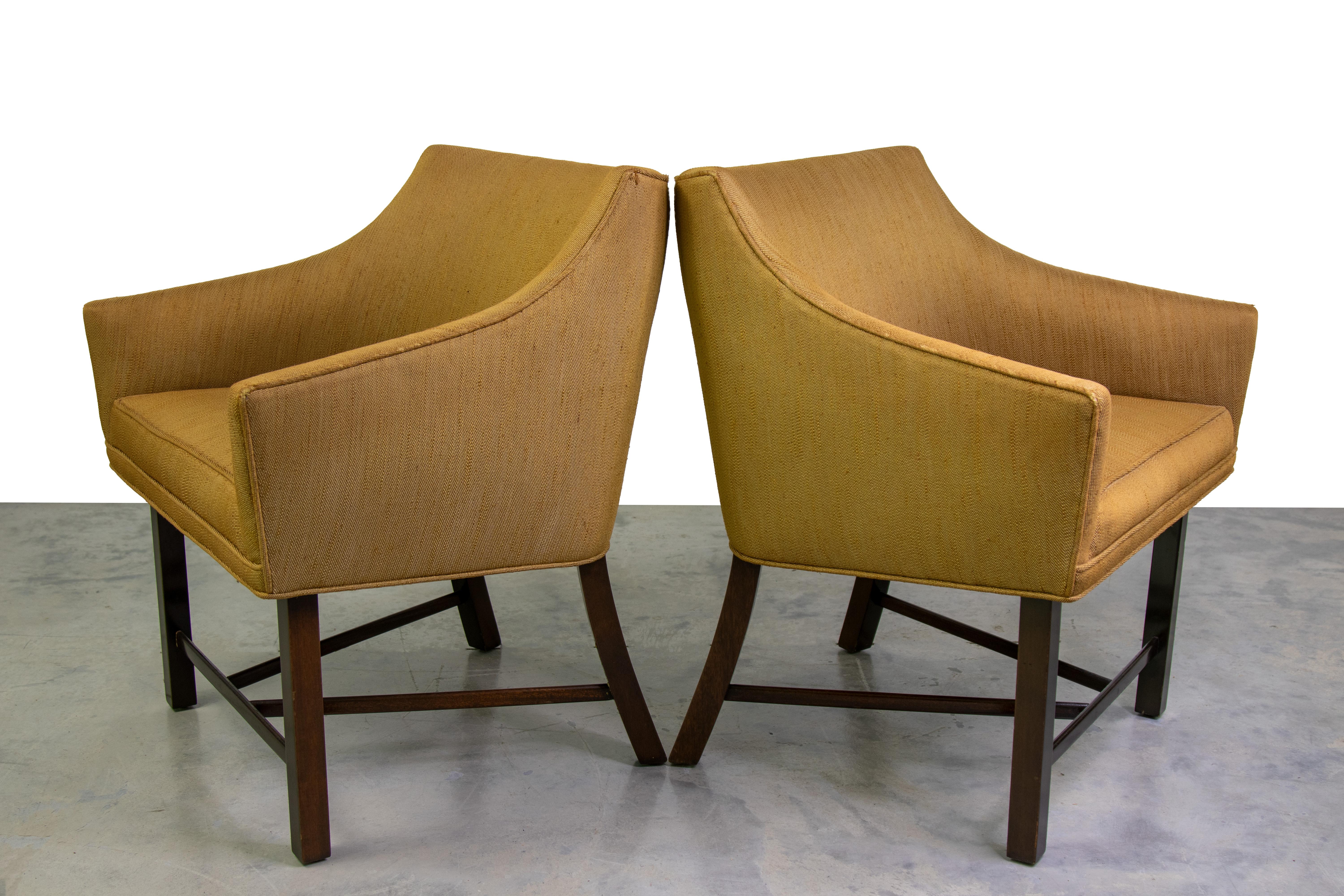 An elegant pair of Harvey Probber Lounge Chairs with curved mahogany legs. Similar lines to Edward Wormley, these chairs are smaller in scale and would work equally well in a large living room space or in front of a desk.  Beautiful design packed in