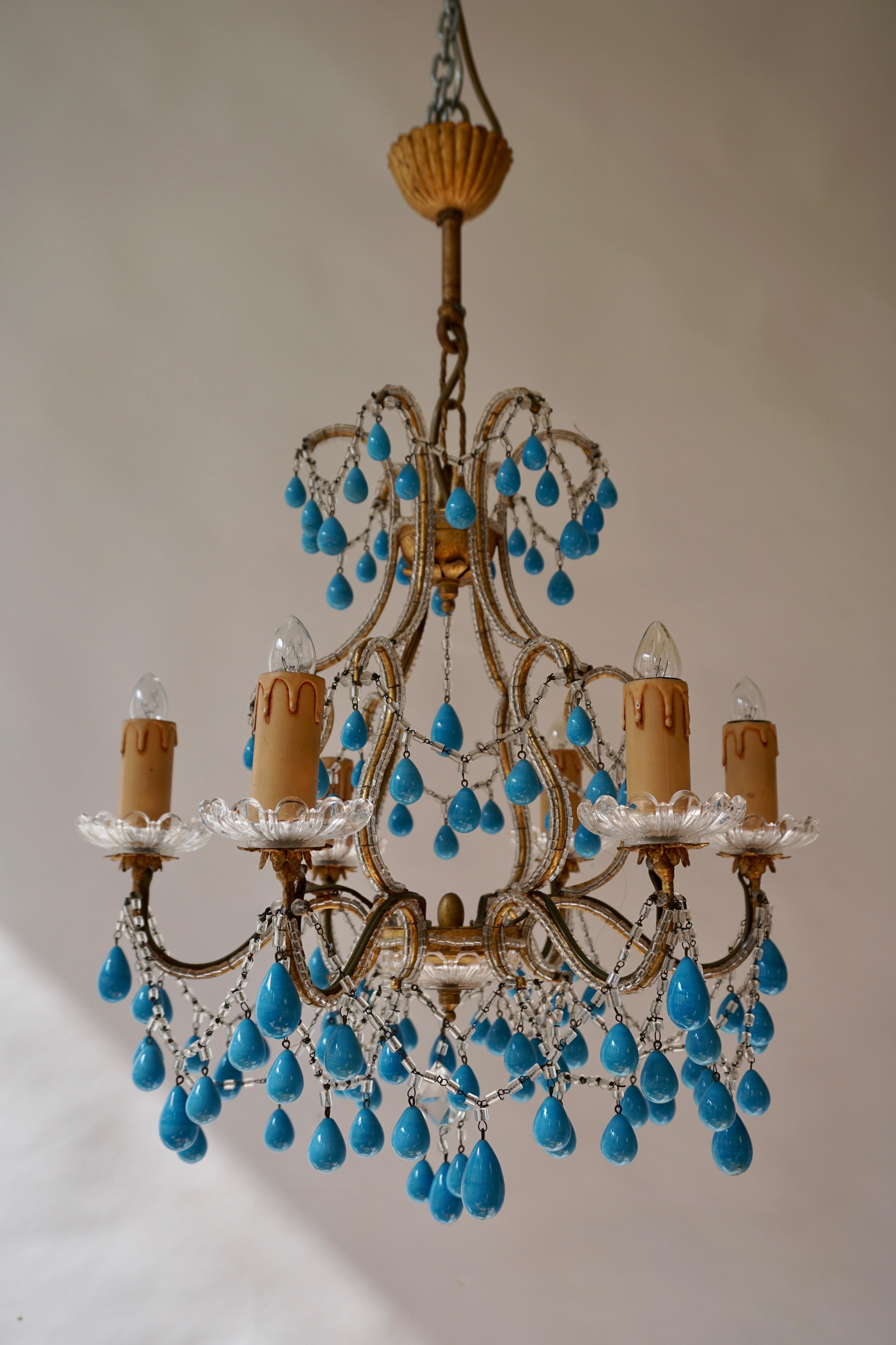 Two six-arm chandeliers with blue stone drops.
Measures:
Diameter 45 cm.
Height fixture 45 cm.
Total height 65 cm.
Six E14 bulbs.