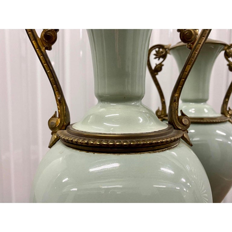 Pair of elegant sage green porcelain table lamps with Ormolu mounts, circa 1940

Simply some of the finest lamps in our collection. We think you'll agree.

8