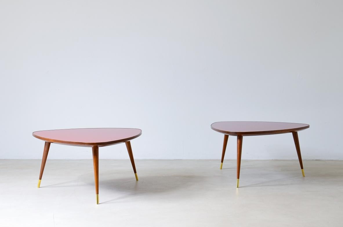 COD-2539
Pair of elegant semi-triangular shaped coffee tables with wooden structure and France blue opaline glass top.
Officina Antiquaria production, Milan Italy