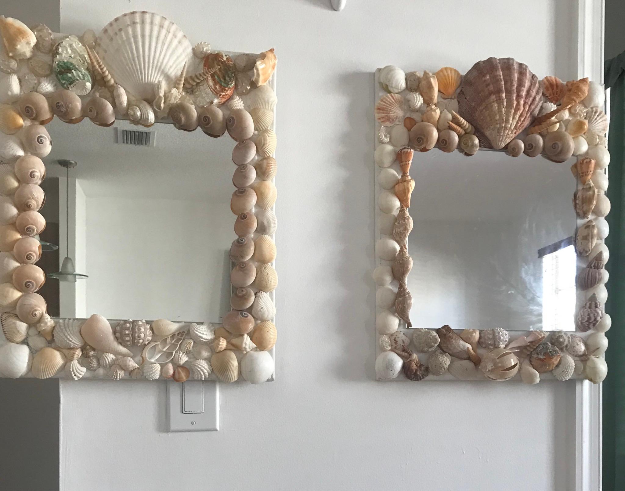 Square mirrors with shells on canvas frame.