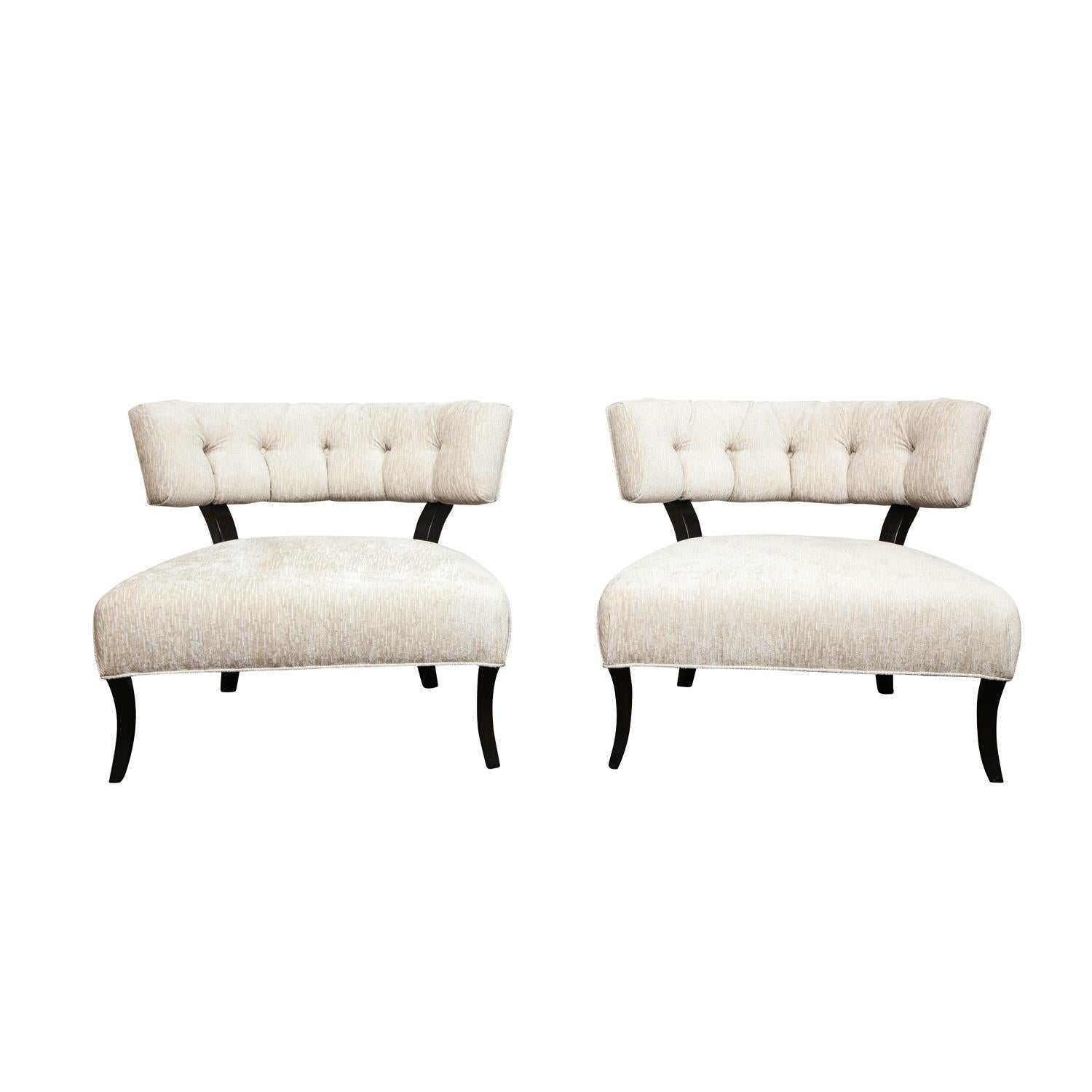 Pair of elegant slipper chairs, tufted backs with gently curving legs, in the manner of Billy Haines, American 1940's. These chairs have beautiful scale and are very comfortable. These have been newly reupholstered and refinished by Lobel Modern.