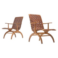 Set of four Elegant Spanish Armchairs in Patinated Woven Leather