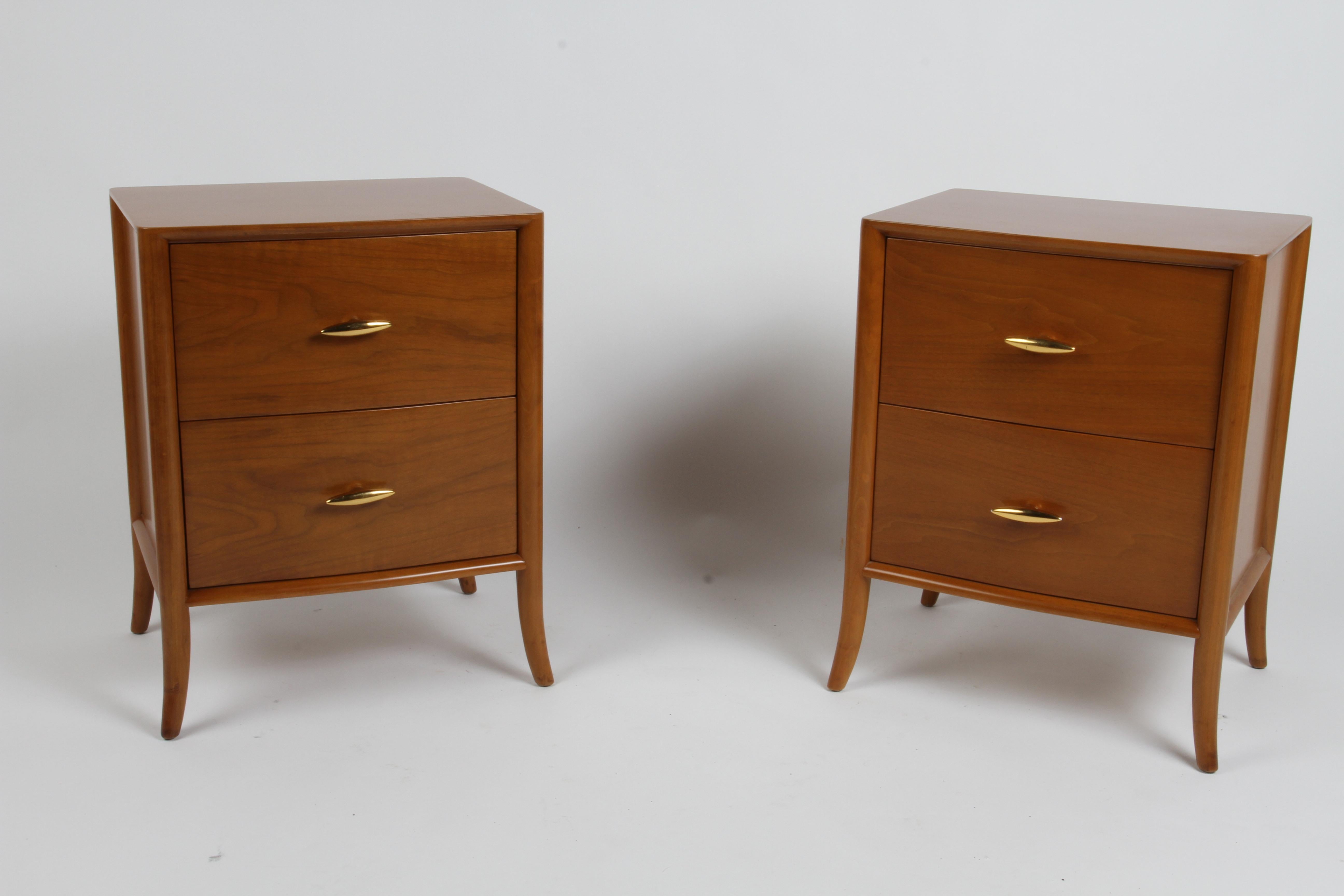 Pair of elegant and not often seen T. H. Robsjohn-Gibbings two drawer nightstands or end tables with serpentine front for Widdicomb, walnut veneer refinished to original color on splayed legs, drawers having 22-carat gold porcelain handles. Light