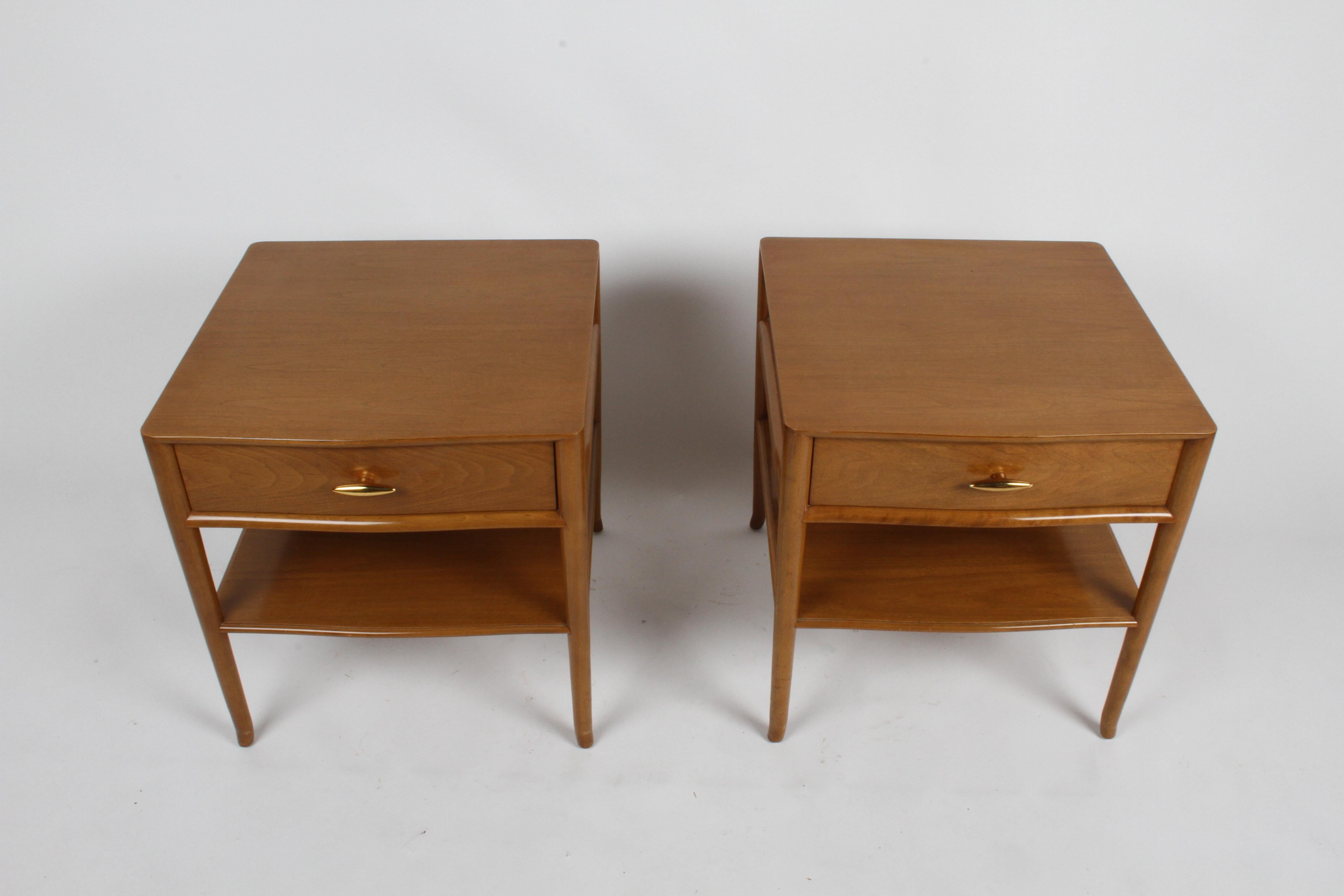 Pair of elegant and not often seen T. H. Robsjohn Gibbings nightstands for Widdicomb, dated 1955, label, walnut with original finish on splayed legs drawers having 24-karat gold porcelain handles. Tops always had glass, glass tops included, but they