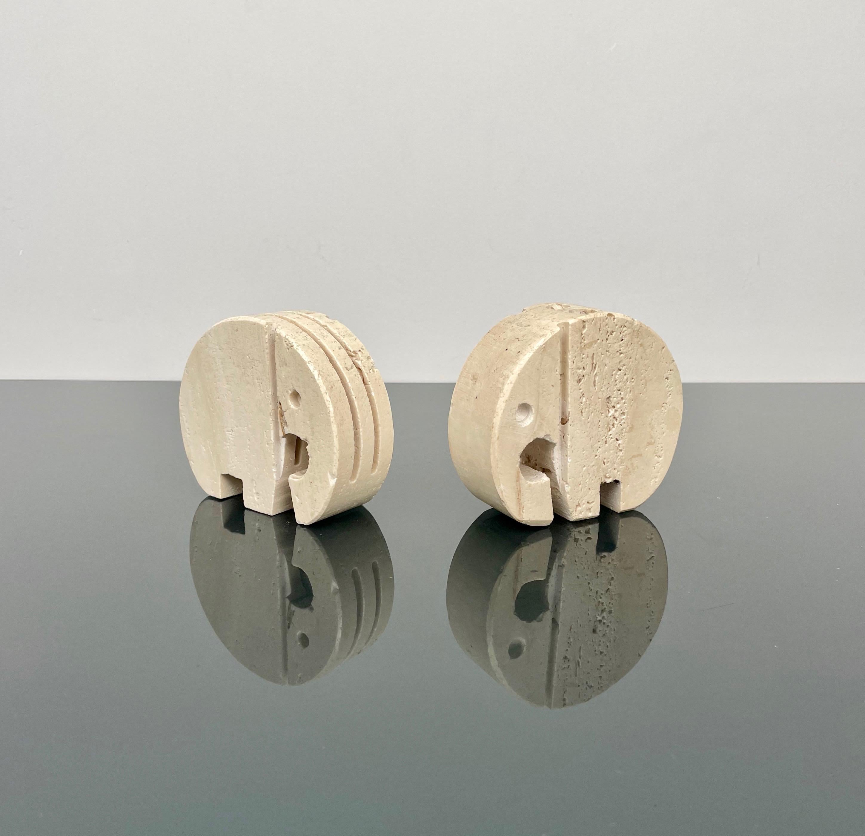 Pair of travertine marble desk accessories in the shape of an elephant attributed to Fratelli Mannelli. 

Made in Italy in the 1970s. 

One elephant could be use as a pen holder while the others as a card holder.