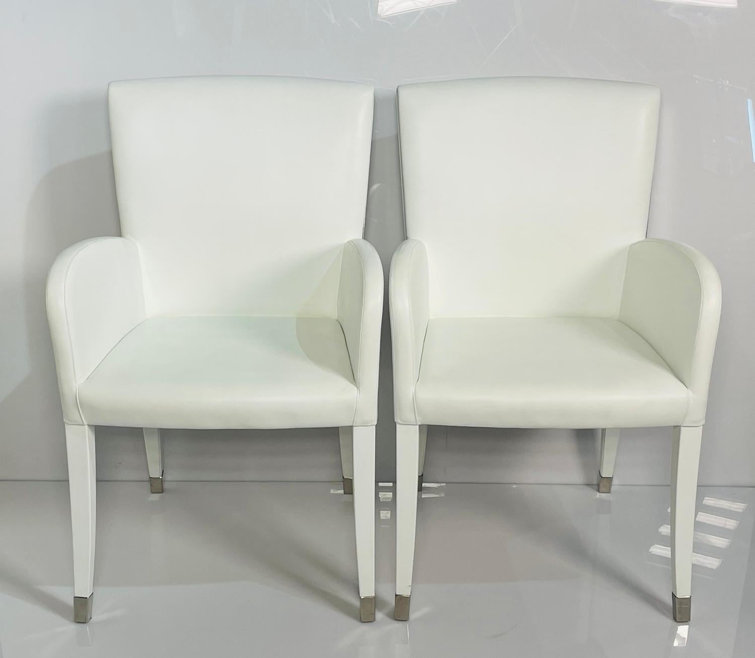 Pair of armchairs embossed in white leather and metal accents from the Elisa Collection, designed and manufactured by Fendi.

The chairs retains manufacturers label.

Measurements:
37 inches high x 23 inches wide x 23 inches deep x 19 inches