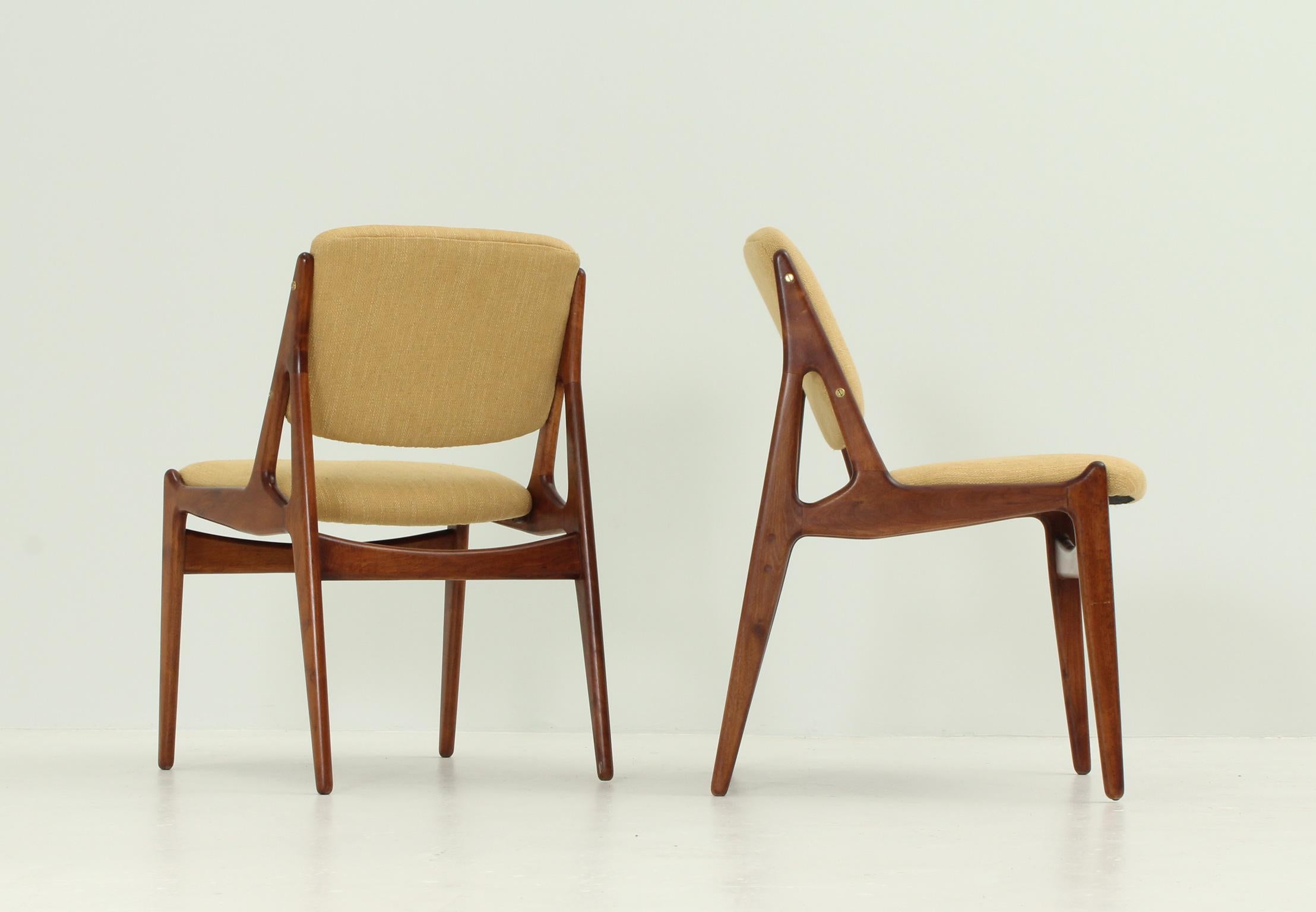 A pair of Ella chairs designed in 1962 by Arne Vodder for Vamo, Denmark. Teak wood and new upholstery.