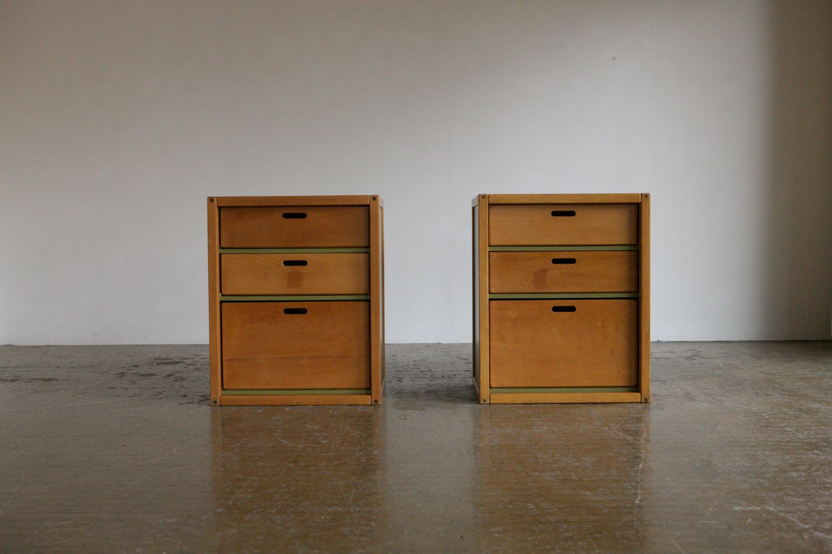 This is a really great pair of chests by Elmar Flötotto in beech with green side and back panels. The chests have a very pleasing utilitarian look and feature his signature finger joints and colour block panelling. Stand together as a large chest or