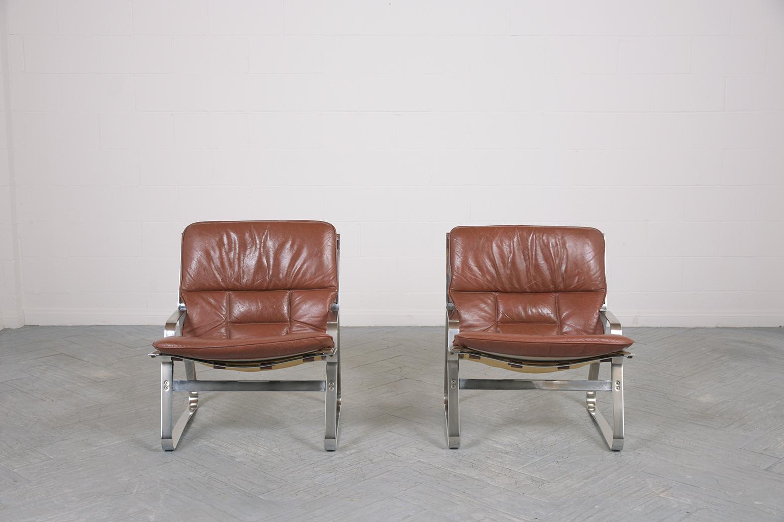 Indulge in the luxury of Norwegian design with our exquisite pair of mid-century modern lounge chairs, a creation of the iconic designers Elsa & Nordahl Solheim and masterfully manufactured by Rykkin & Co. These chairs are a perfect representation