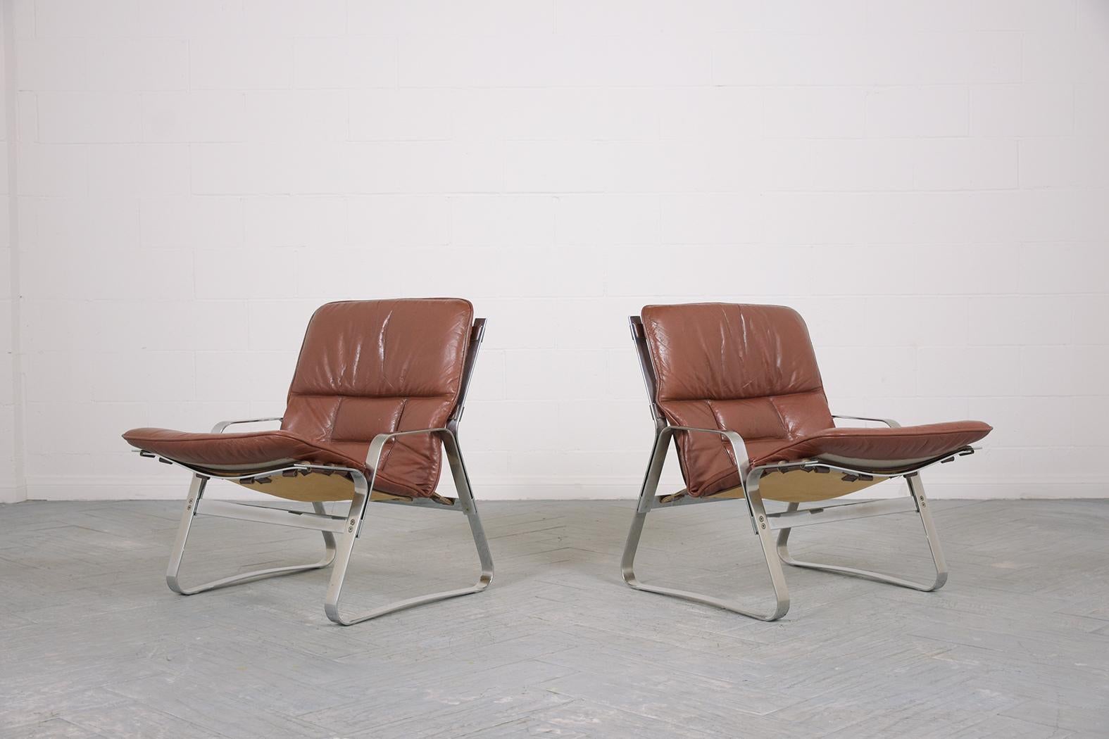 Restored Elsa & Nordahl Solheim Mid-Century Modern Leather Chrome Lounge Chairs In Good Condition In Los Angeles, CA