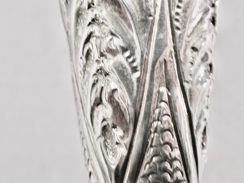 Pair Of embossed silver vases, London Assay, 1901, Jackson & Fullerton.
3.45 Troy ounces of sterling silver, no loading.
Pretty decoration of leaf and flower work with fluting and gadrooning.
 