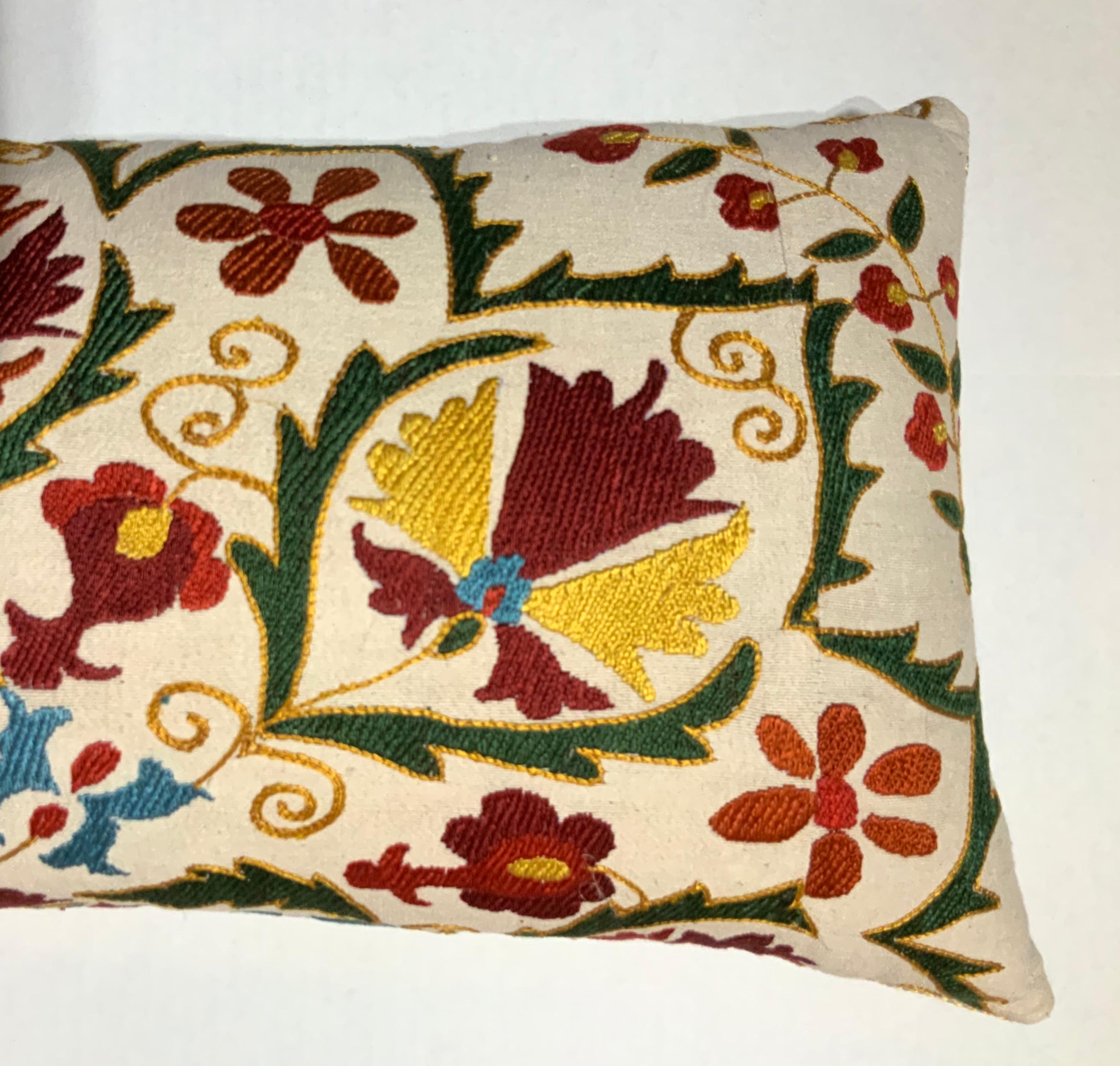 Beautiful pair of pillows made of hand embroidery silk on cream color background, vebrent colors of red, green, indigo turquoise and gold, of exceptional motif or vines flowers and pomegranates. Fine cotton backing with fresh new