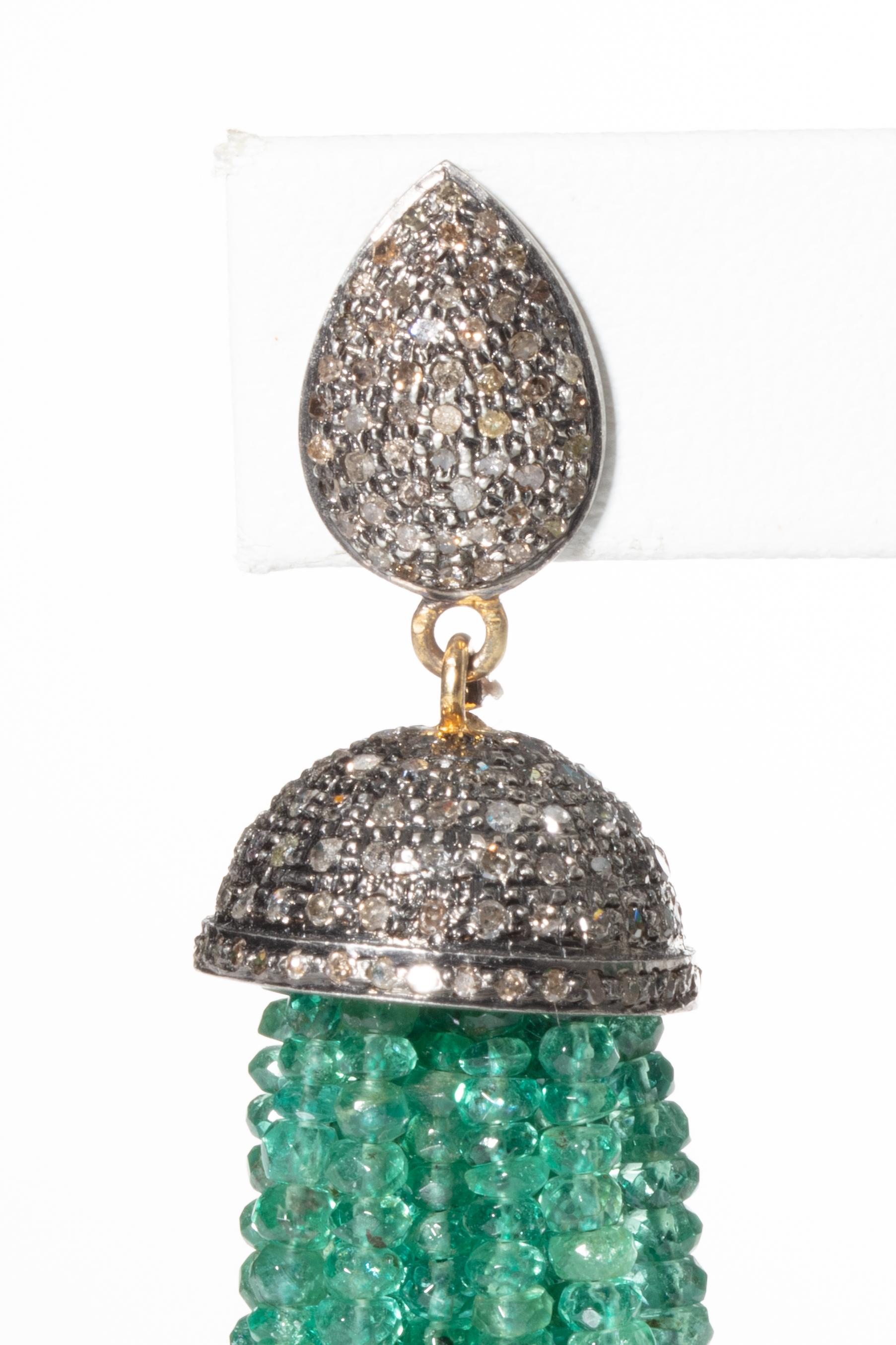 Pair of faceted emerald tassel earrings with pave`-set diamonds on the end cap and top of the post.  18K gold post for pierced ears.  Carat weight of diamonds is 2.84.  The faceted Colombian emeralds are 192 carats.  Stunning.