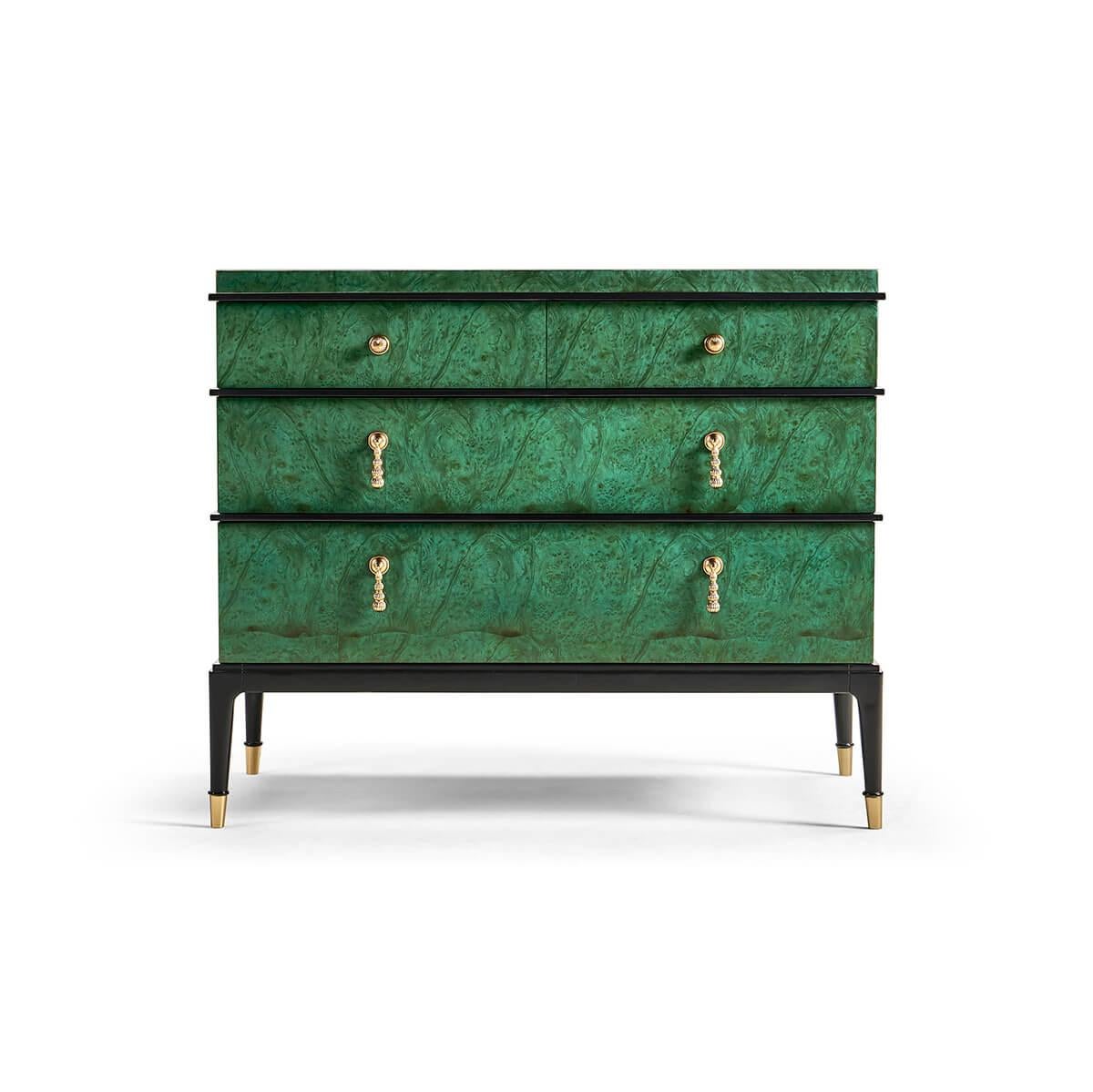 striking design with blended elements from the Art Deco and Mid-Century modern styles. With a striking Emerald Green finish to the burl wood veneers, clean lines, bold contrasts, and minimalist elements make this a statement piece that seamlessly