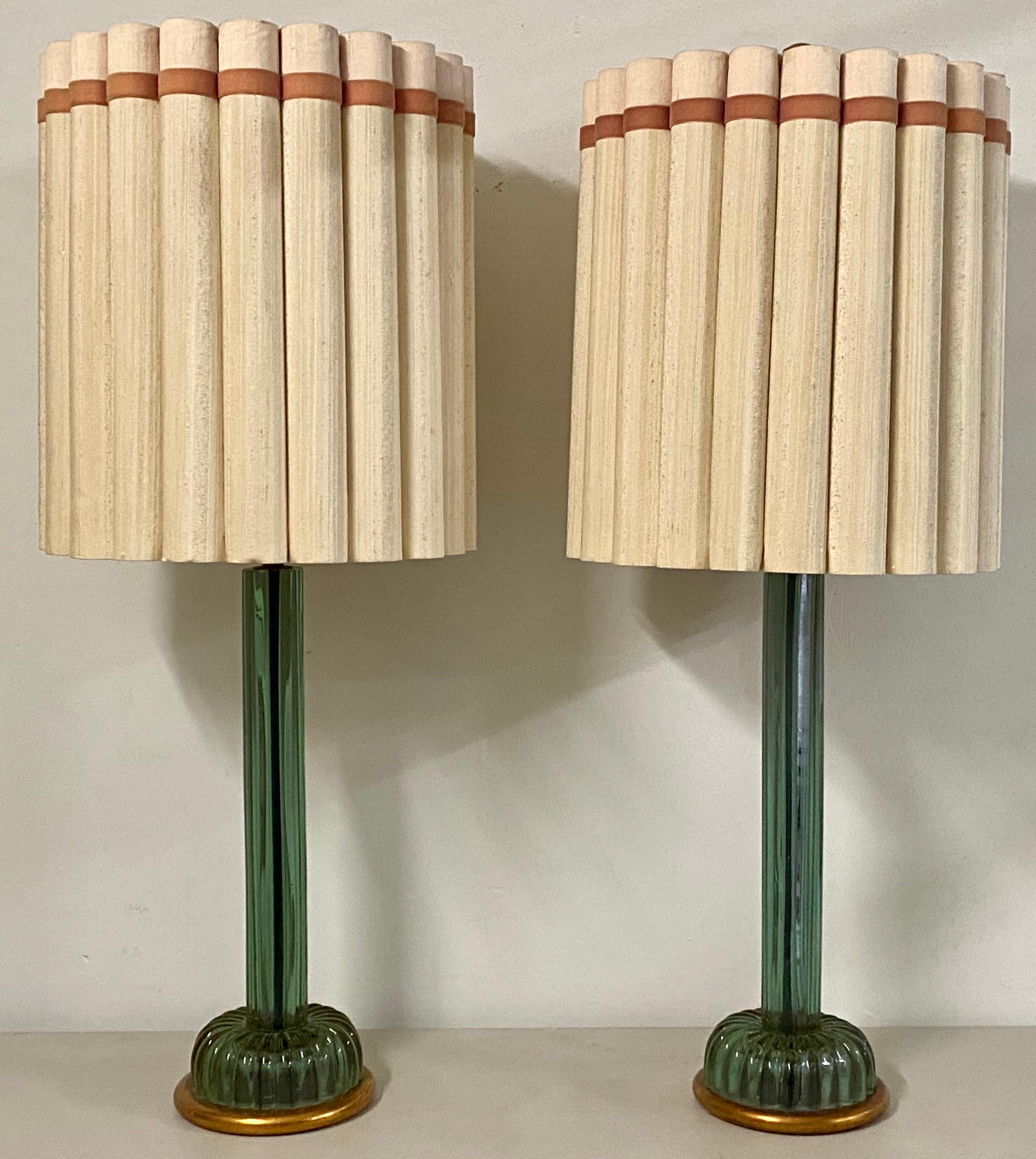 Pair of matching emerald green murano glass lamps by Marbro Lamp Company, circa 1950

The Marbro Lamp Company imported Murano glass from Italy to make their lamps

This is an outstanding tall and elegant pair of molded glass lamps. 

Each lamp