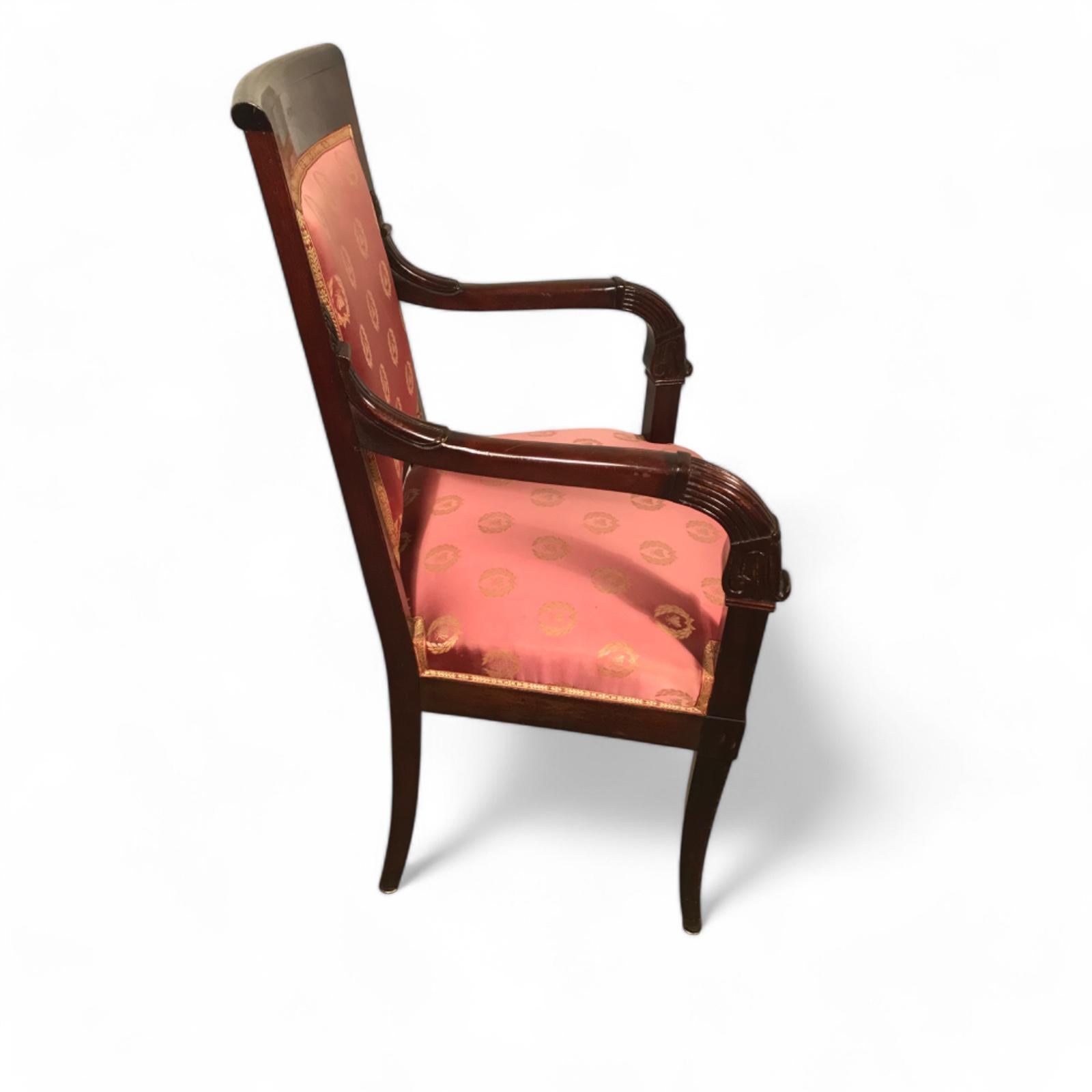 Pair of Antique Empire Armchairs from France, Circa 1810

Discover this exquisite pair of Empire armchairs, crafted in France around 1810. These elegant chairs feature rich mahogany wood and intricate carved details on the armrests, showcasing the