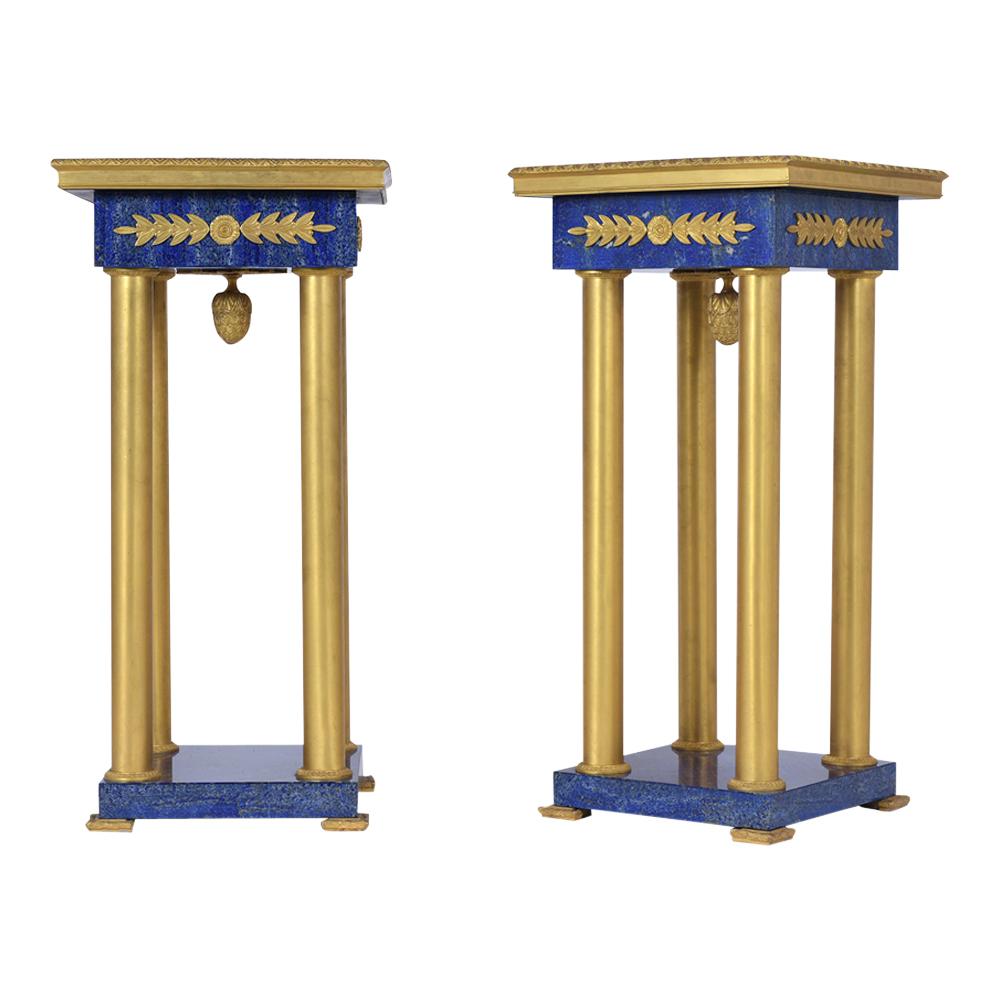 An extraordinary pair of empire directory pedestals hand-crafted out of bronze and restored by our team of expert craftsmen. These exquisite pair pedestals come with a square top and base covered with lapis lazuli marble veneers framed with molding