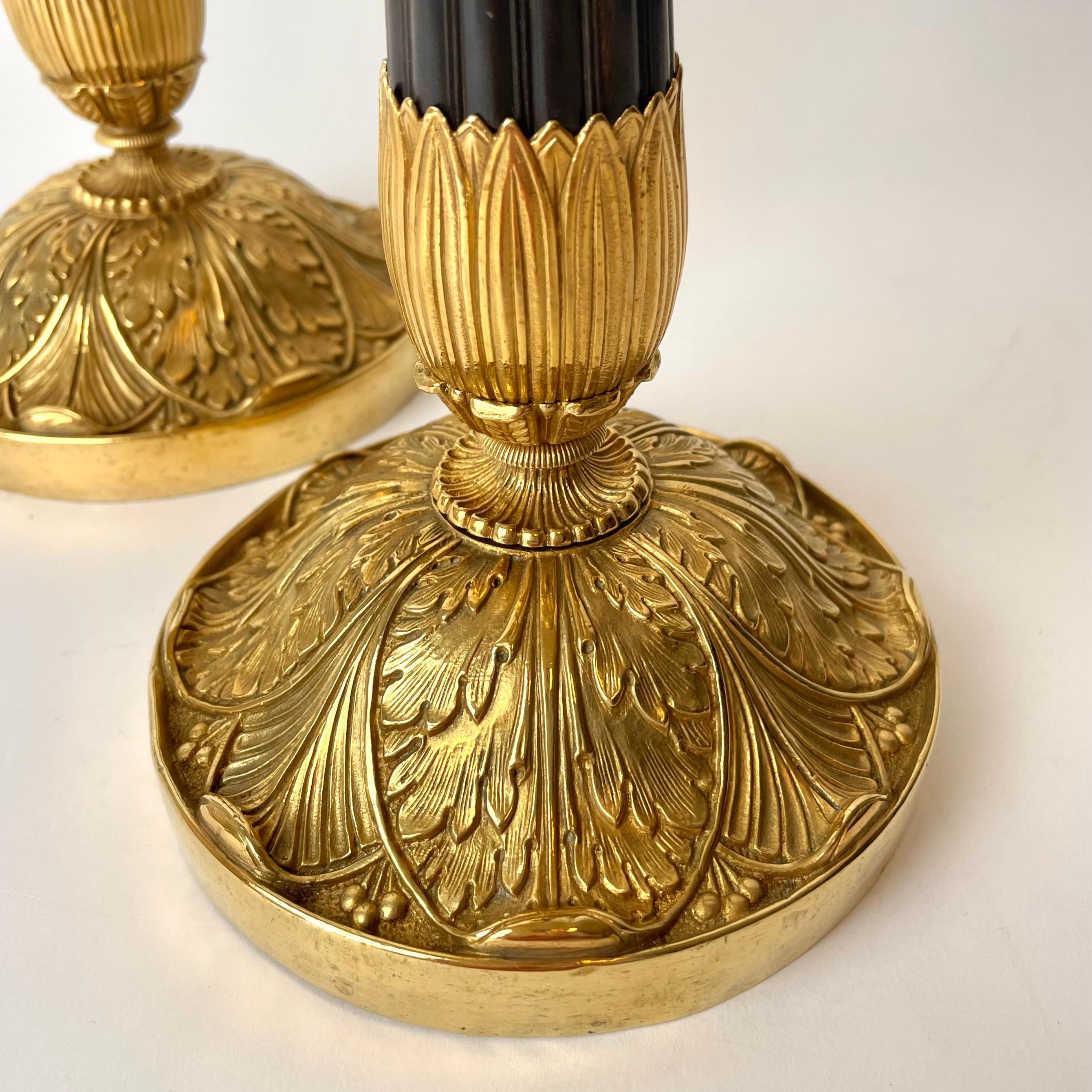 Gilt Pair of Empire Candlesticks, Gilded and Patinated Bronze, Early 19th Century For Sale