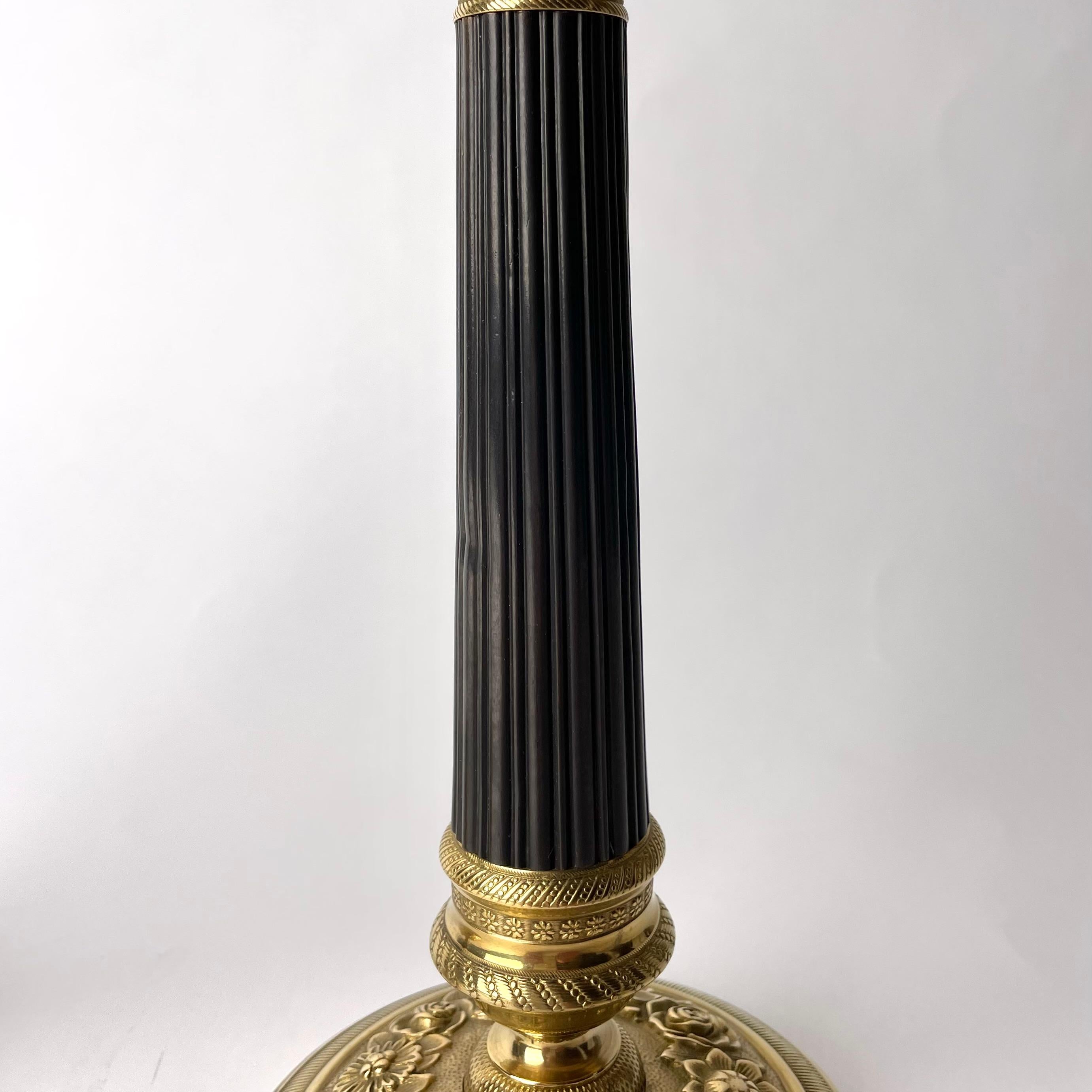 Early 19th Century Pair of Empire Candlesticks in gilt and dark patinated bronze from the 1820s For Sale