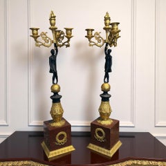 Coppia di candelabri Impero in bronzo dorato e patinato, inizio XIX secolo