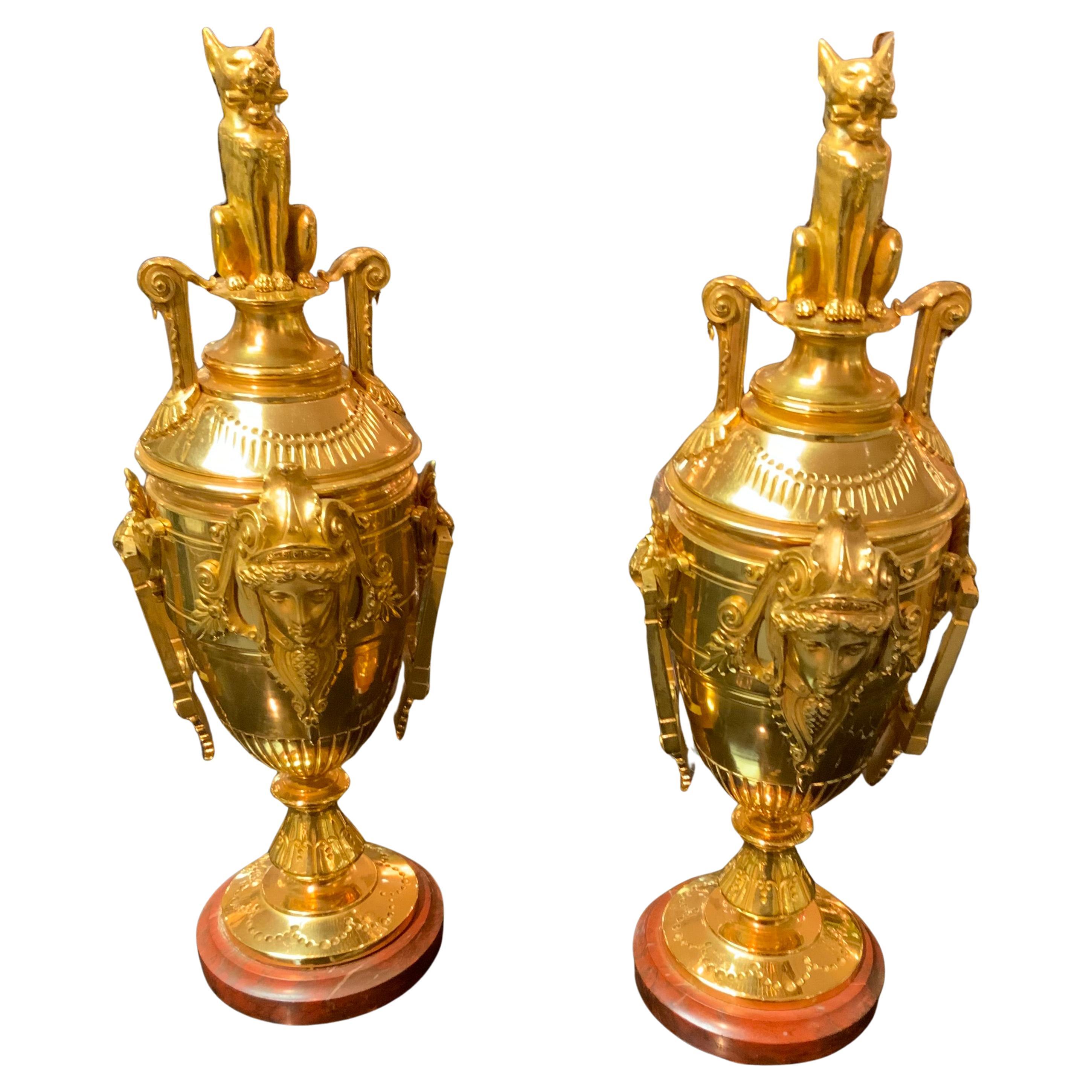 Pair of empire gilt bronze garniture on rouge marble base For Sale