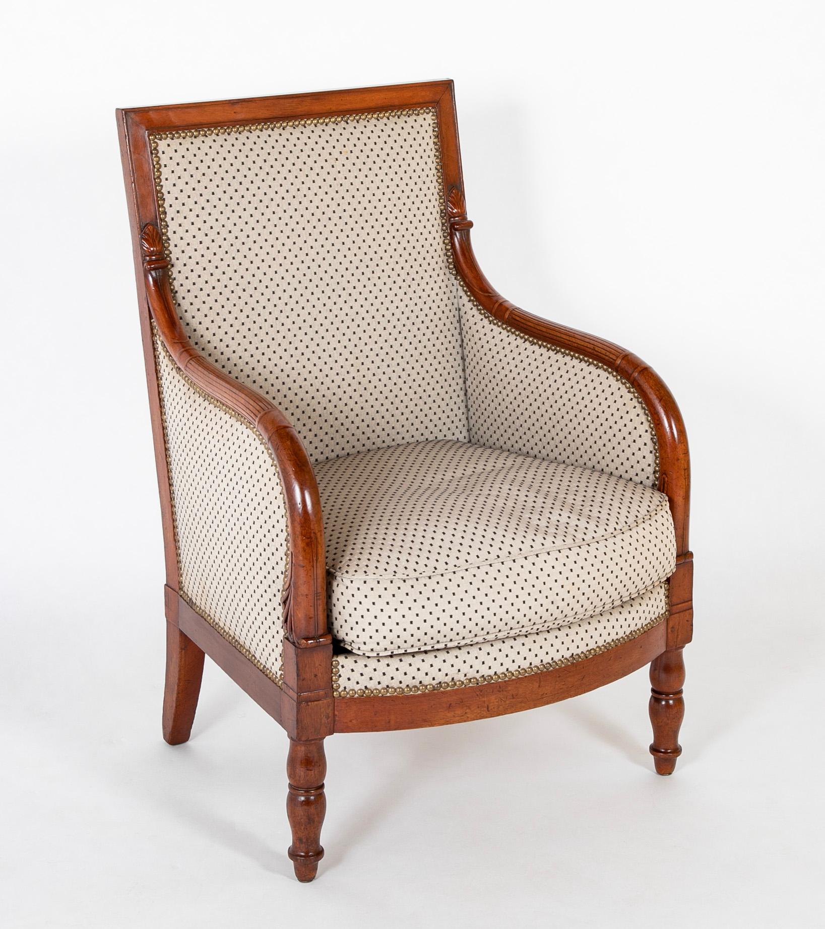 This pair of capacious, perfectly designed and executed chairs was created by the workshop of George Jacob and his son, Francois, during the Empire period at their Parisian workshop on the rue Meslee.  The Jacobs were a prime furniture dynasty
