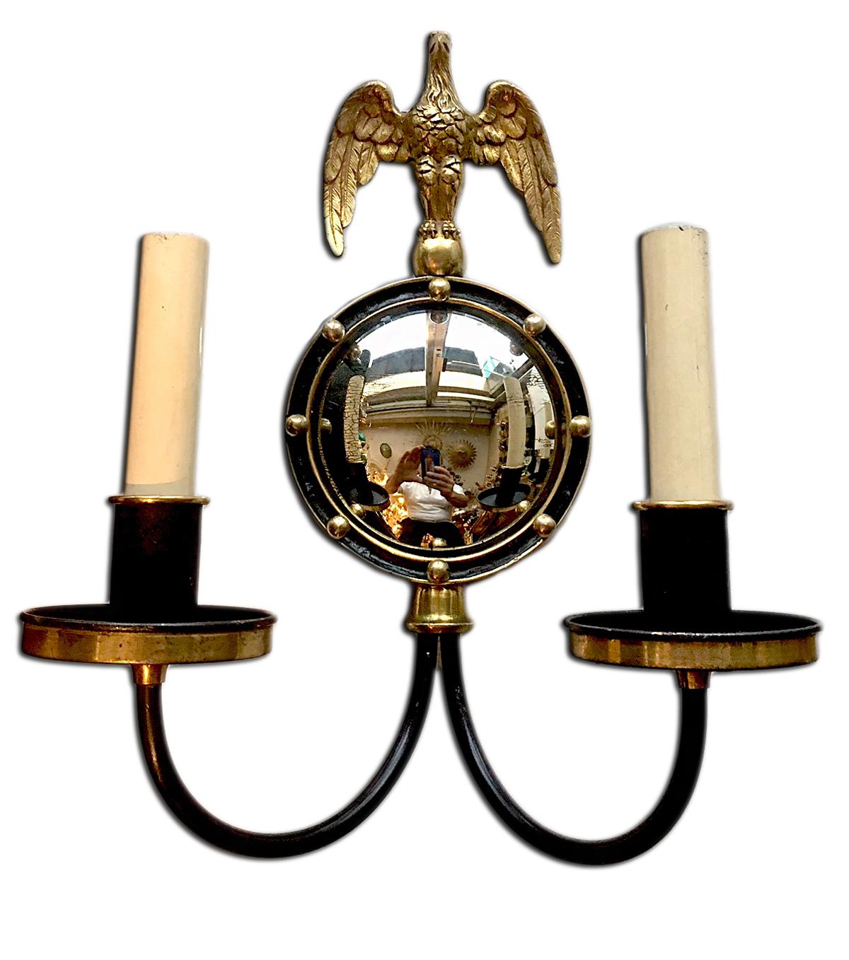 A pair of Empire Style circa 1920's American gilt bronze sconces with painted finish and mirror inset in backplate, eagle motif on back plate.

Measurements:
Height: 14
