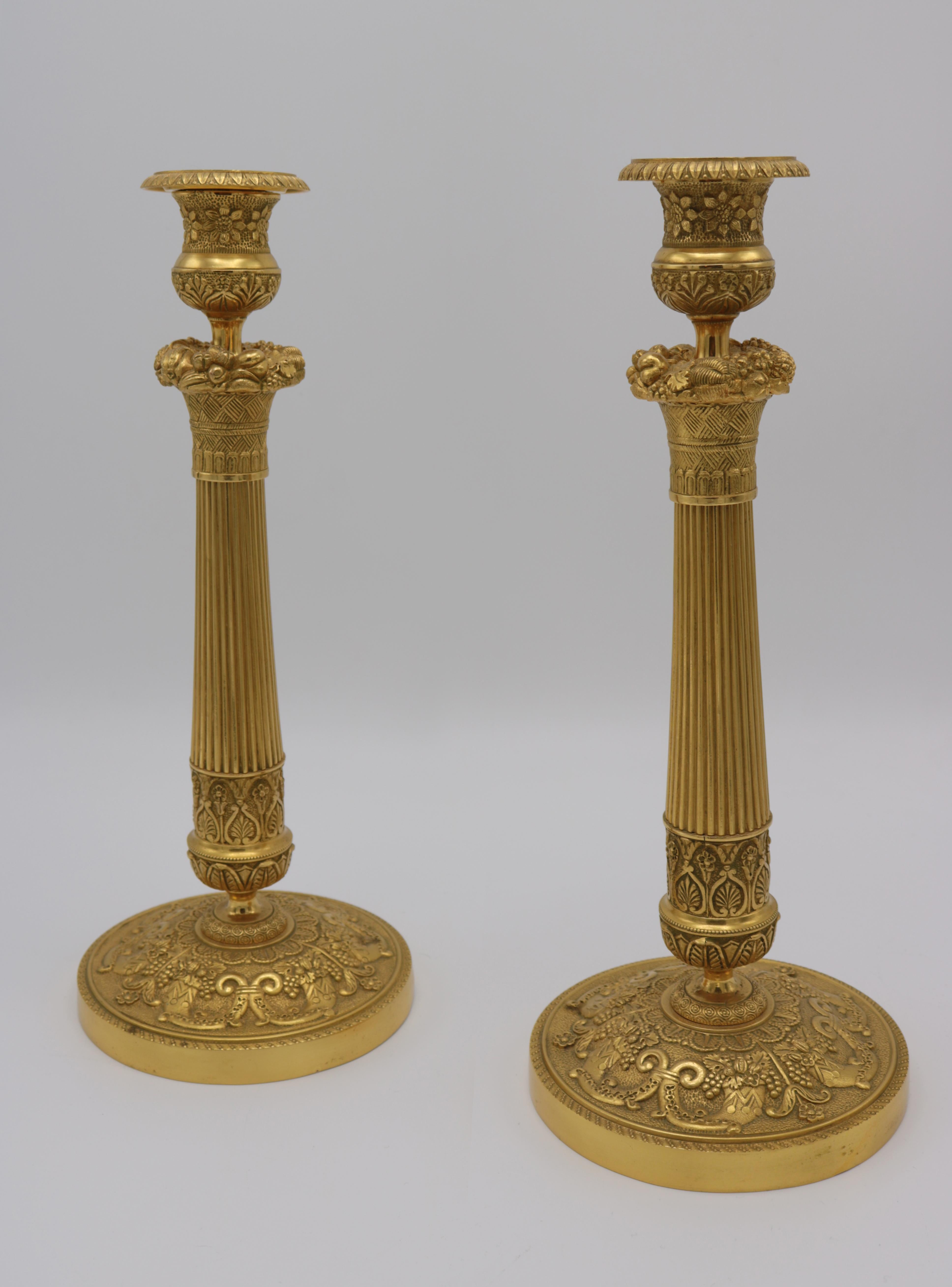 A fine pair of Empire Ormolou candlesticks.