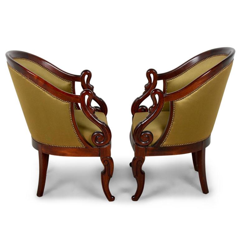 A pair of elegant French, Empire-style armchairs with carved scroll arms and a swan motif, circa 1940. Very comfortable and would be perfect for the living room, bedroom, or den.





  