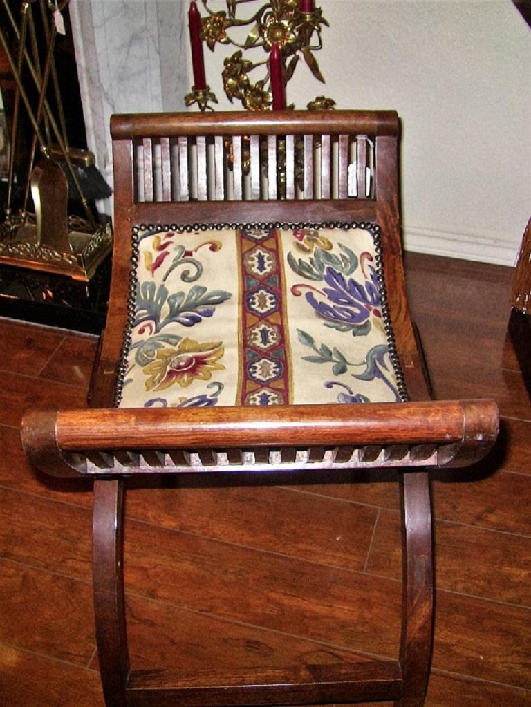 Lovely pair of Empire style bedroom scroll-end seats or benches.

One in the form of a bench to sit at the foot of a bed and the other for sitting at a dressing table.

Both re-upholstered with fine floral fabric and decorative upholstery pins,