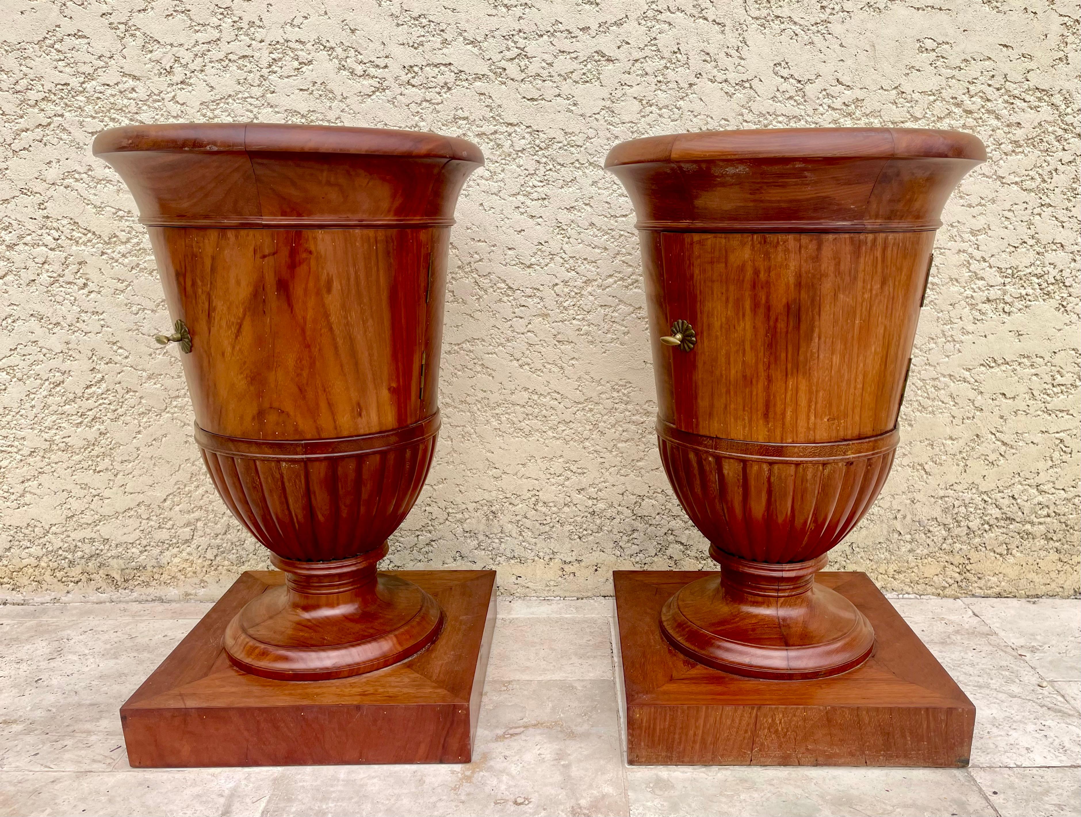 Rare pair of Empire style bedside tables / somnos. They open with a door and have a grey veined marble top. They are in good condition. Fine quality French work dating from the 19th century. 
 
 Dimensions
 Height 73.5cm
Diameter 46cm 
 Base - 41cm
