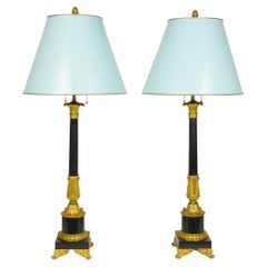 Pair of Empire Style Black Stone and Ormolu Lamps