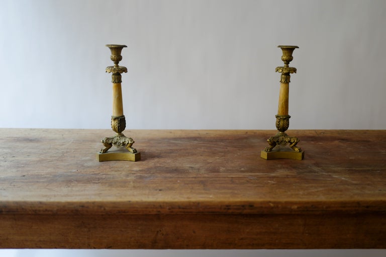 Pair of Empire-style bronze and Sienna-marble candlesticks, ca. 1830, offered by Mallory Kaye