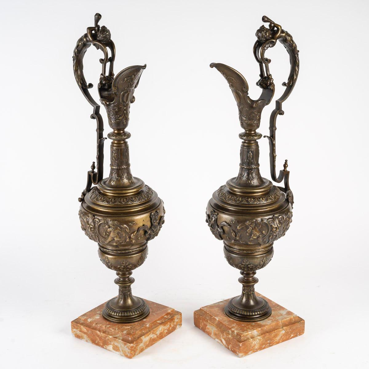 An important pair of Empire style bronze ewers, late 19th or early 20th century.

A pair of Empire style patinated bronze ewers with marble base, late 19th or early 20th century.
H: 60cm, W: 20cm, D: 15cm