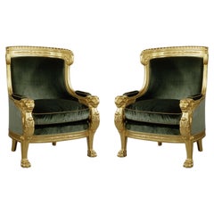 Antique Pair of Empire Style Carved Giltwood Tub Chairs with Green Velvet Upholstery.