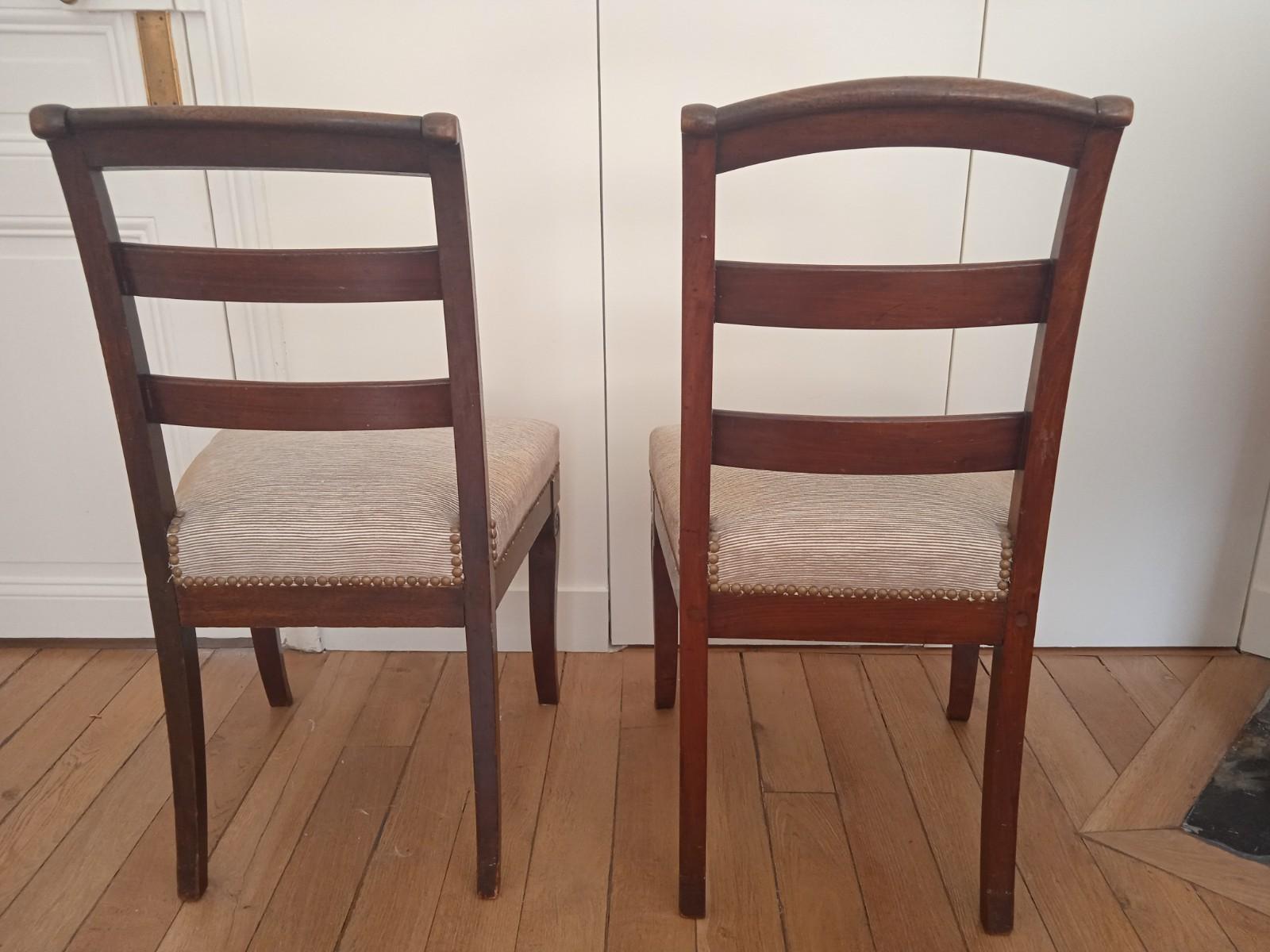 Pair of empire style chairs, front feet carved in frog leg. The fabric has traces of use but the seat is still good.