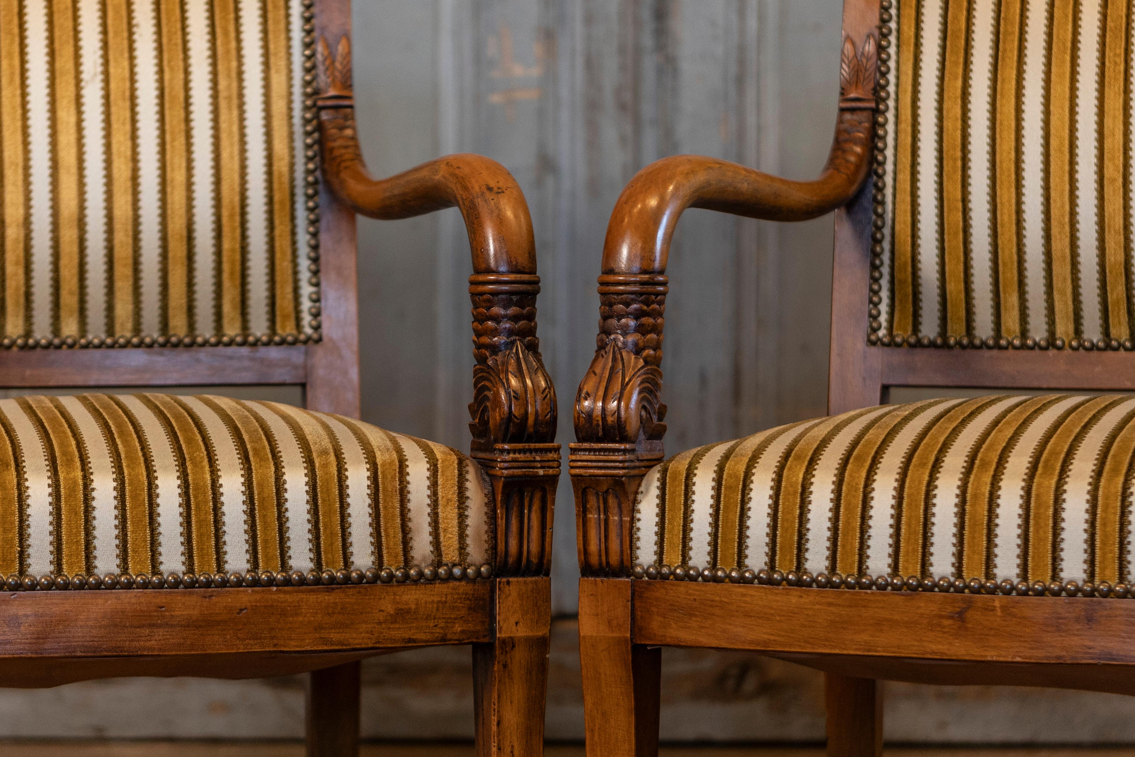 Pair of Empire Style French Armchairs with Foliage Carved Arms and Saber Legs In Good Condition For Sale In Atlanta, GA
