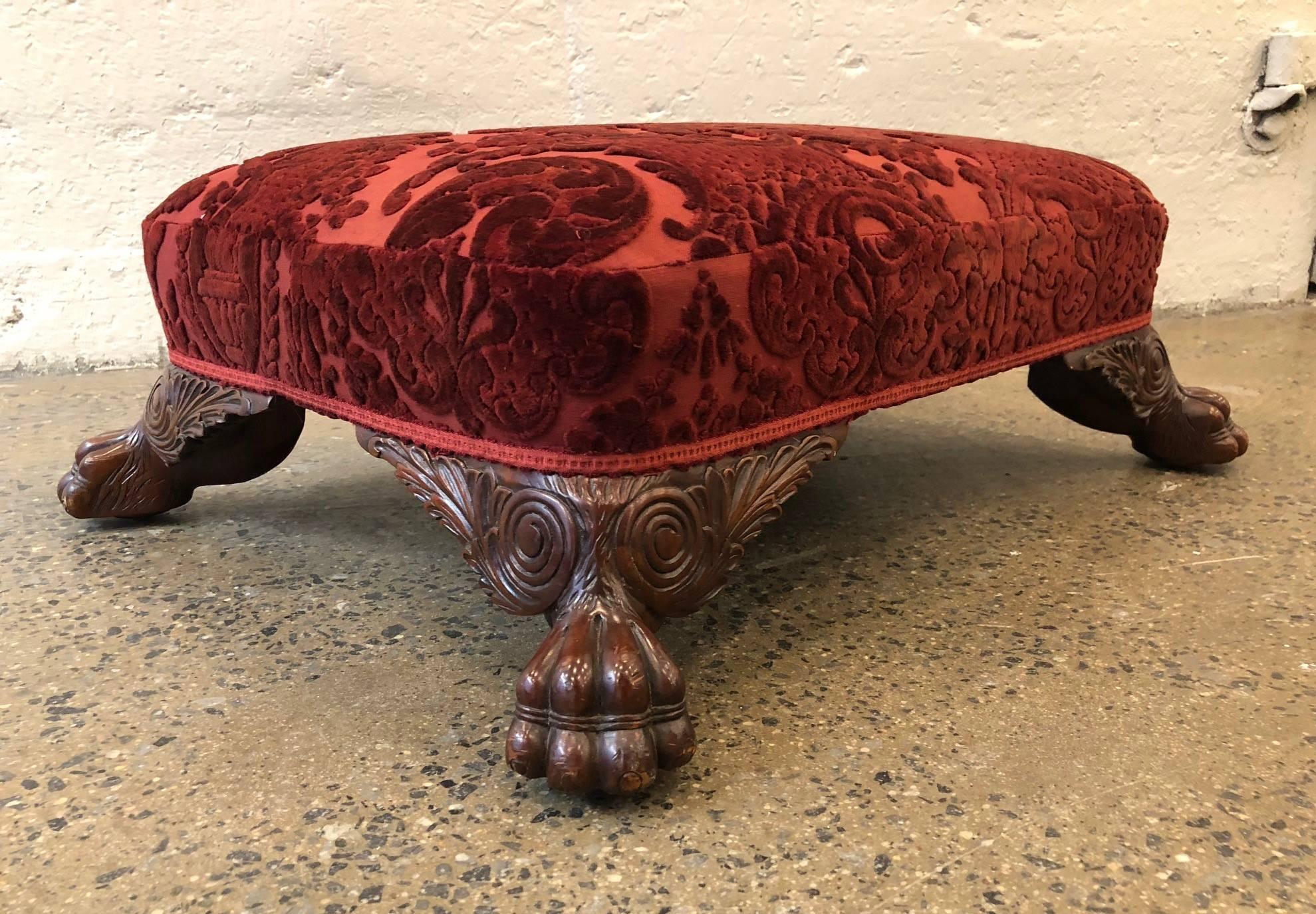 Pair of antique style mahogany, carved, claw feet footstools in Fortuny fabric.