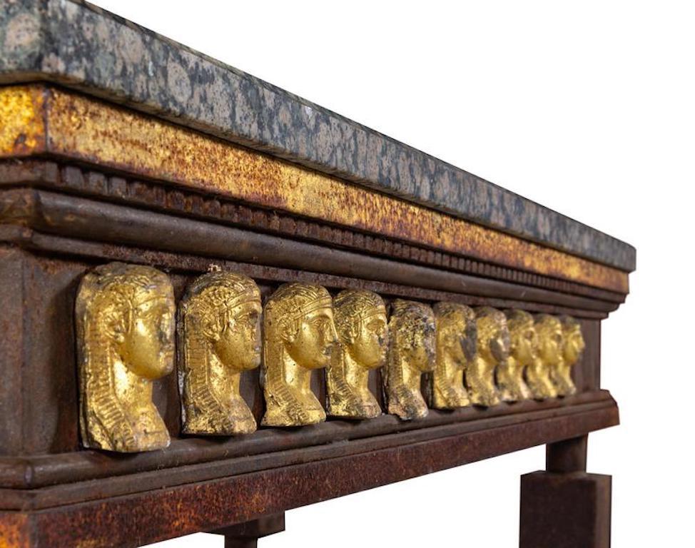 A pair of Empire style parcel-gilt metal console tables,
late 19th-early 20th century
in the Egyptian Revival taste, each with a rectangular stone top.

Measures: Height 35 1/4 x width 56 x depth 26 inches.