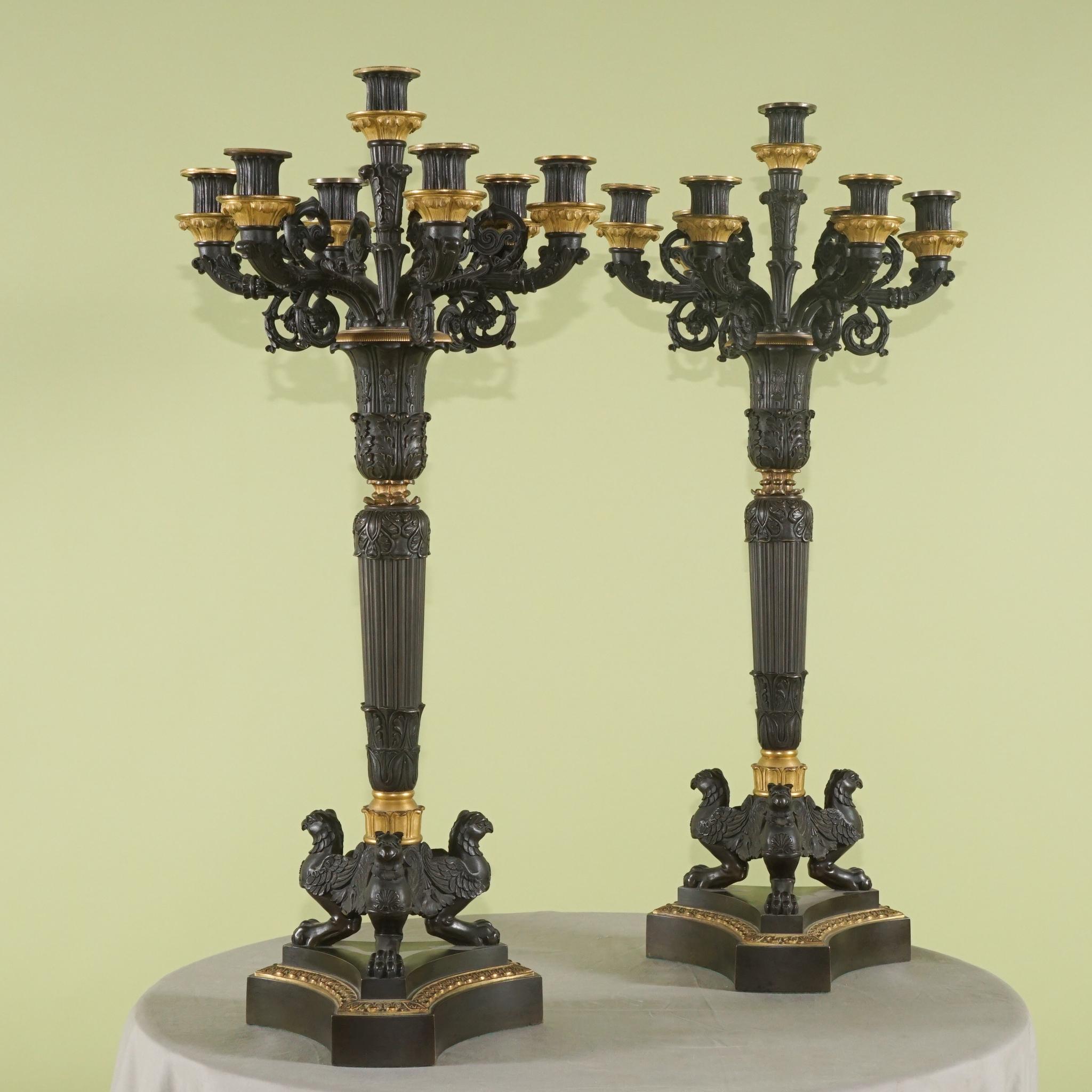 This impressive pair of candelabra made in the era of Napoleon III in France circa 1870 are very powerful and impressive. Heavily cast with references to the classical past and profusely covered with acanthus leaves and pelmets the set is