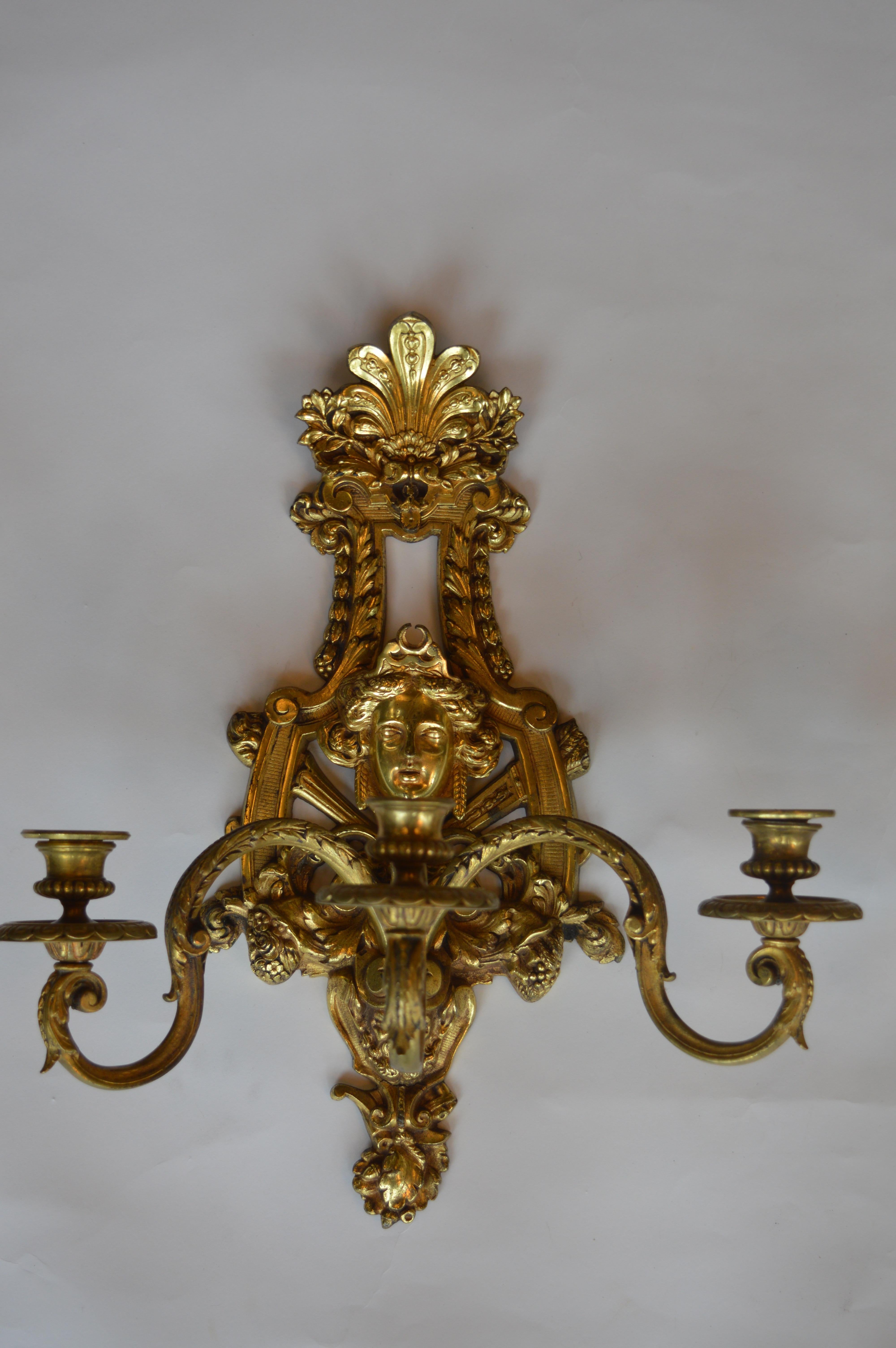 19th century Empire style bronze gold plated sconces.