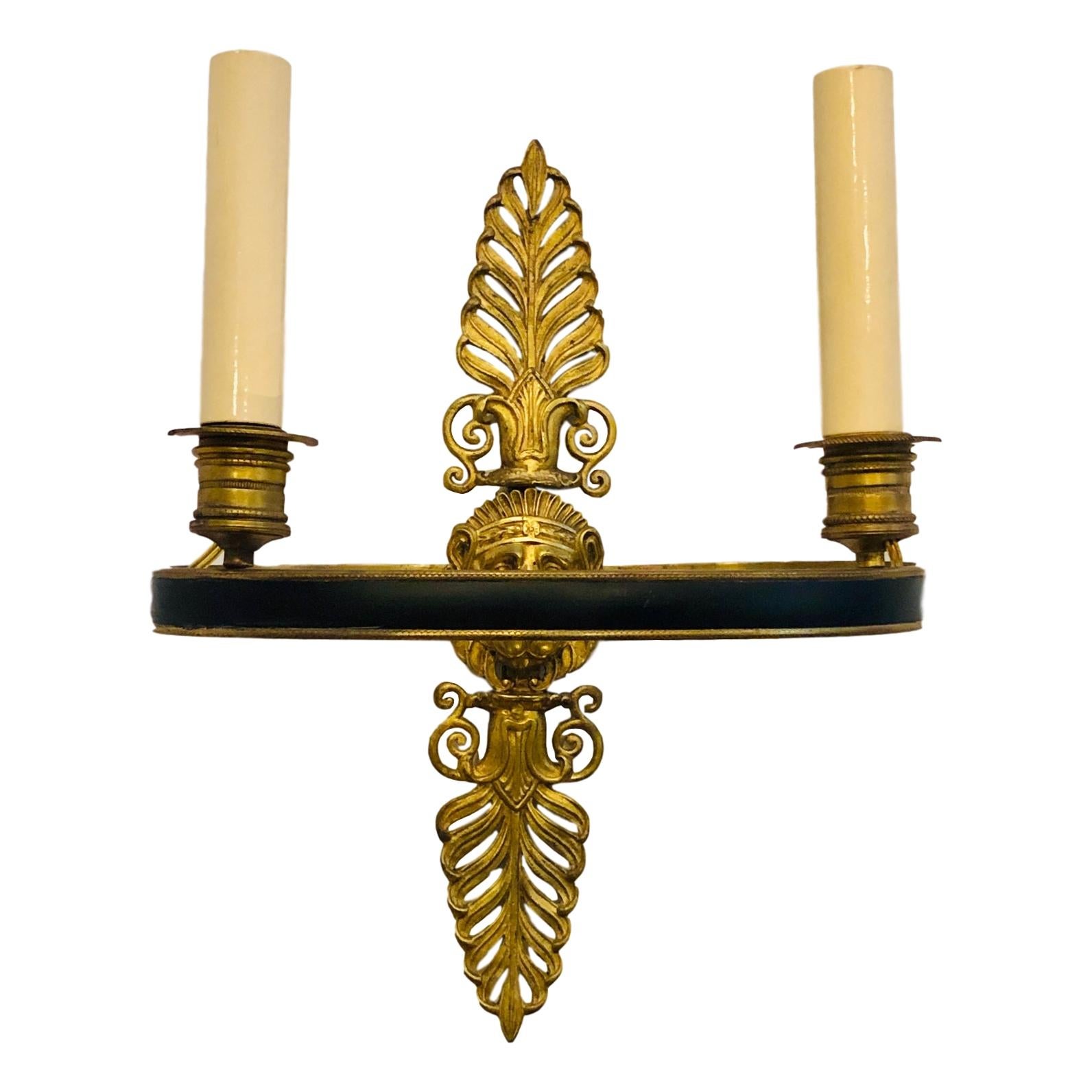 Pair of circa 1920's French Empire style two-light sconces.

Measurements:
Height: 11.5