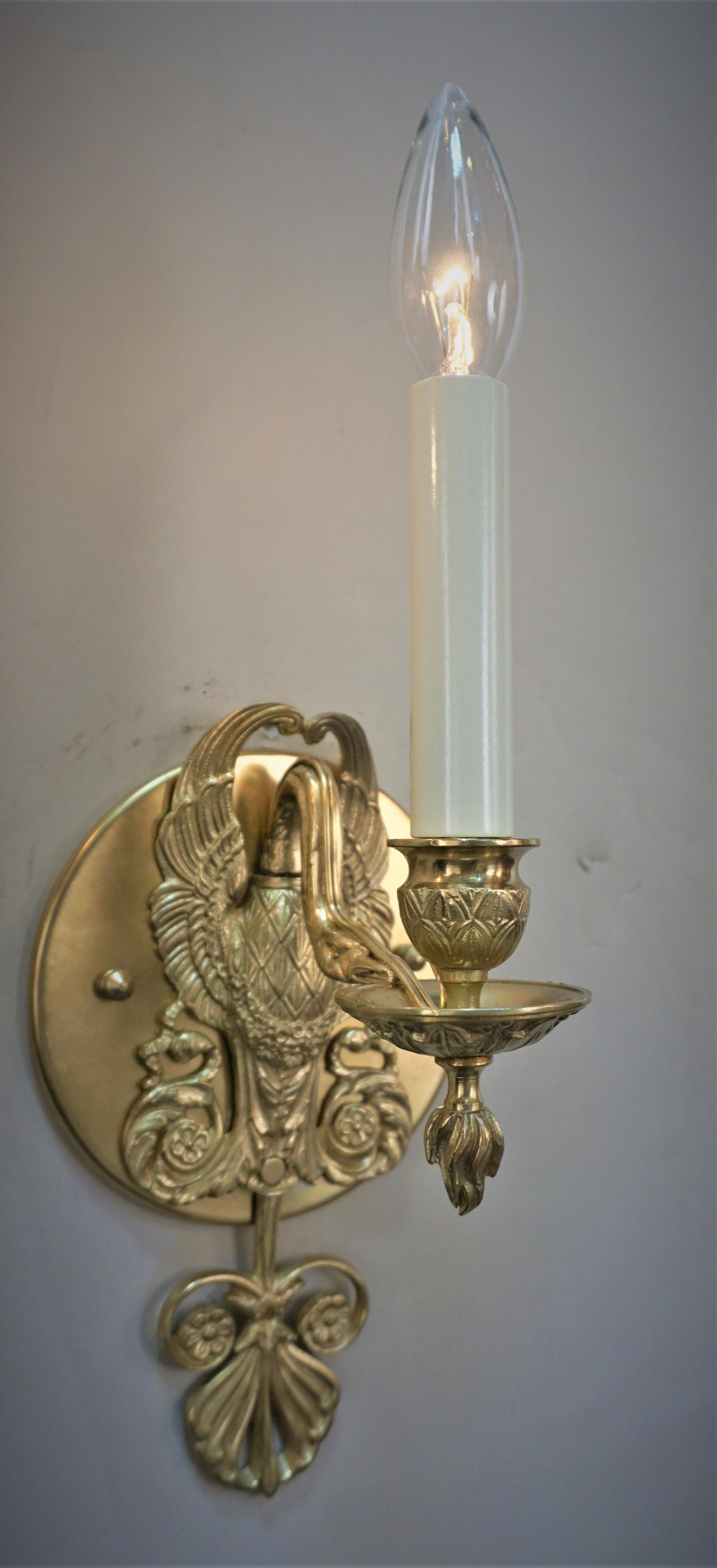 Pair of bronze swan shape Empire style bronze wall sconces.
75 watts max.