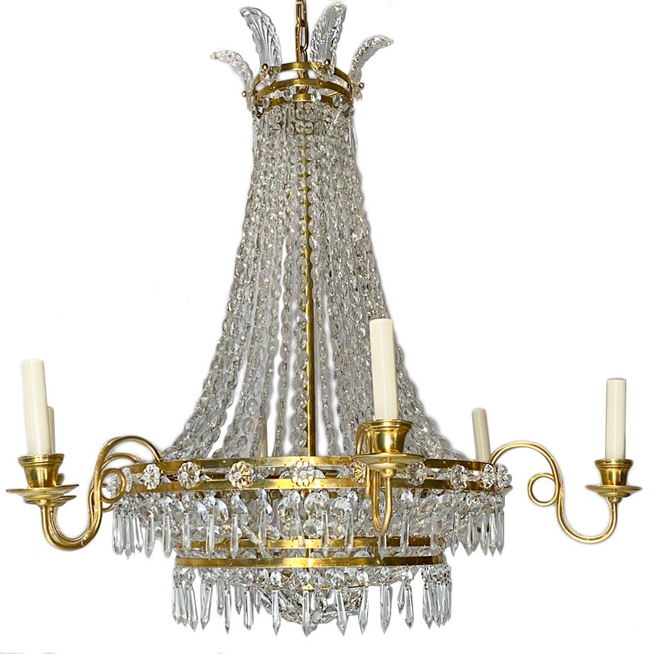 A pair of circa 1940's French six-arm Empire-style gilt metal and crystal chandelier with molded glass details. Sold Individually.

Measurements:
Minimum drop: 33