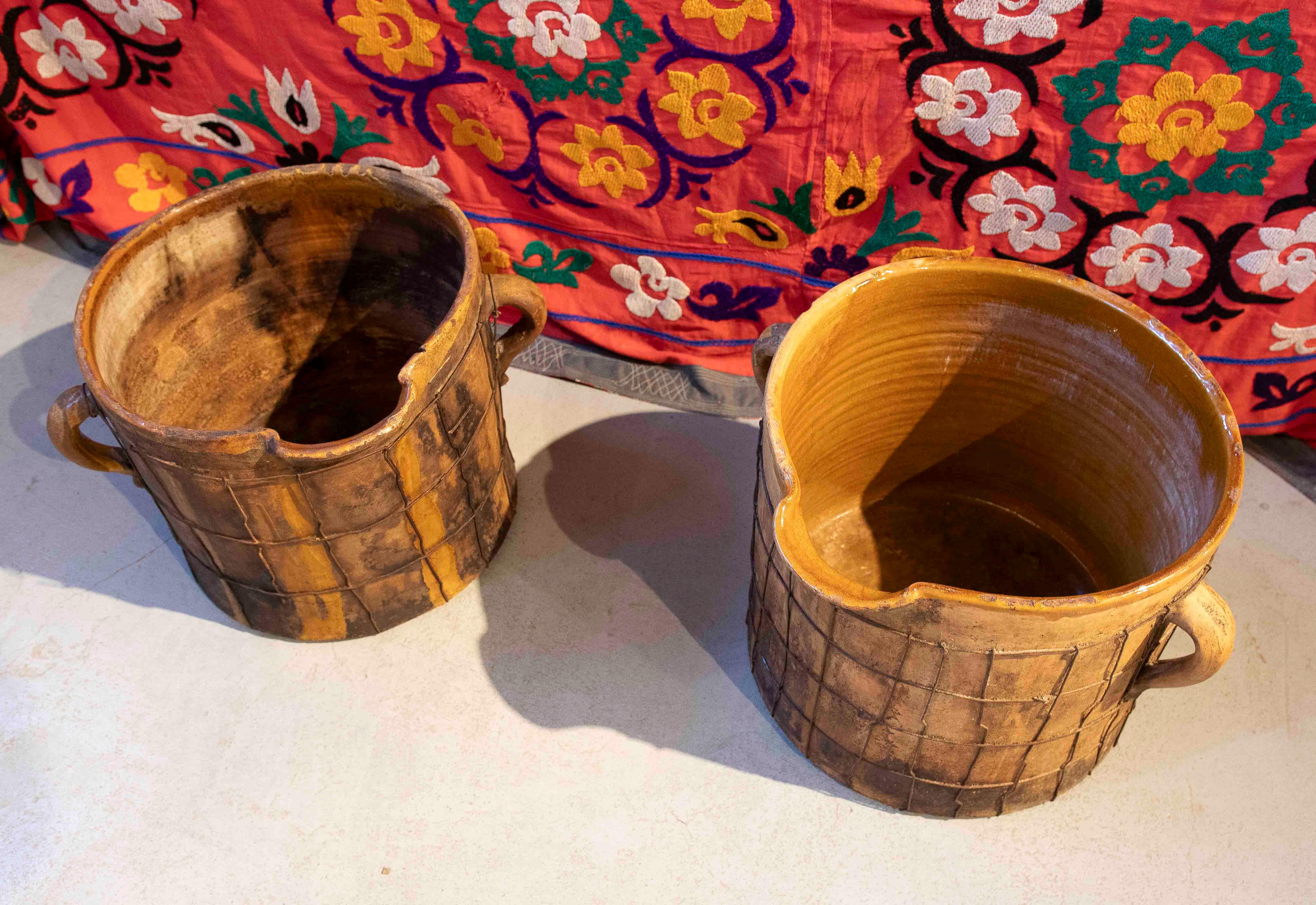 Pair of Enameled Ceramic Milk Churns with Handles & Iron Netting Covering Them For Sale 5